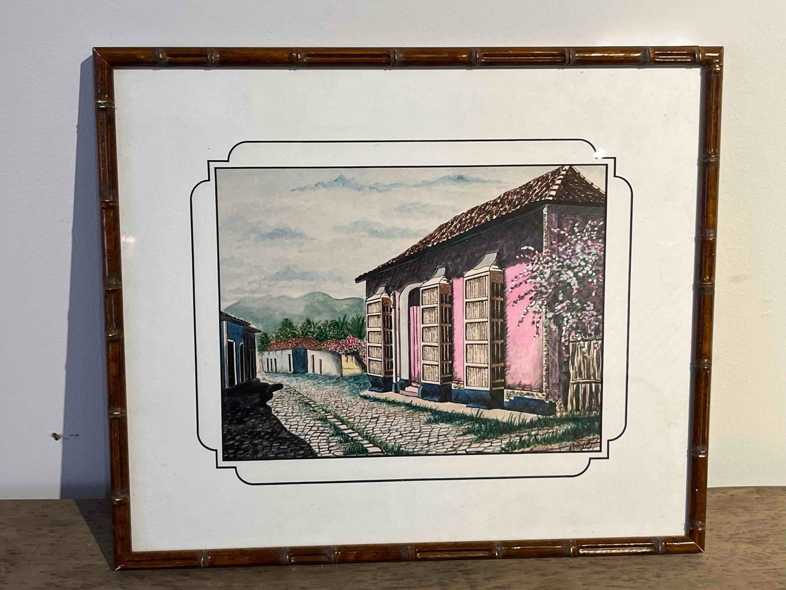 R Villaseca D, Lat Am Street Scene, W/P: This illustrative work is rendered in watercolor and ink on paper, depicting a vibrant colonial architectural scene. The central focus is a pink-walled building on the right, characterized by three ta