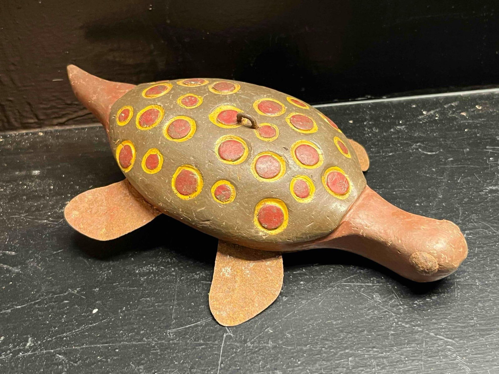 American Folk Art Turtle Fishing Decoy: This is a hand-carved and painted wooden turtle fishing decoy, identified as a piece of American folk art traditionally used for ice fishing. The decoy features a solid body with a domed shell, a proj