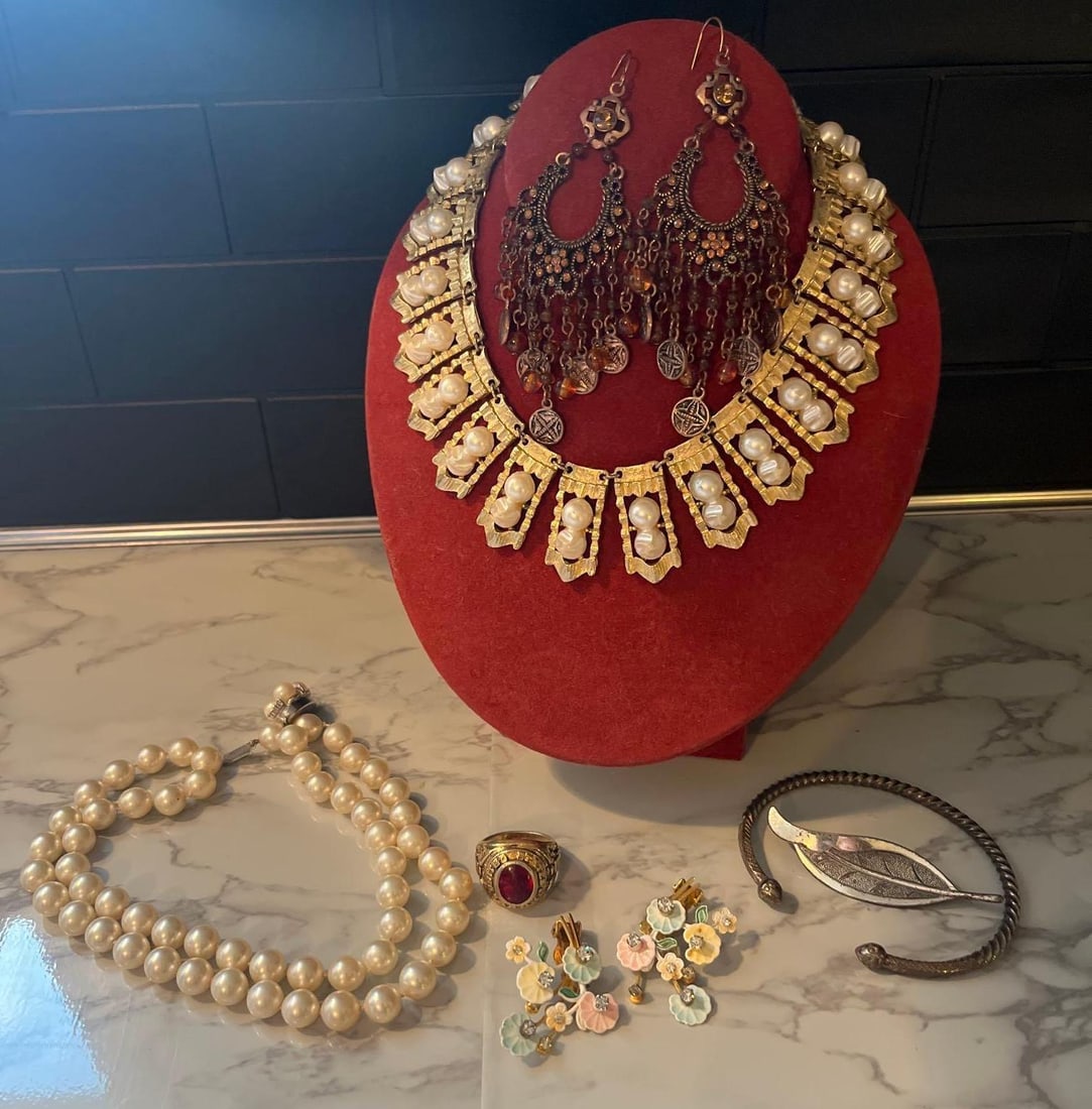 Leru Enameled Earrings & Pearl: An assortment of costume jewelry. The collection includes a statement collar necklace of Brutalist design, composed of articulated gold-tone textured metal panels, each inset with two vertically
