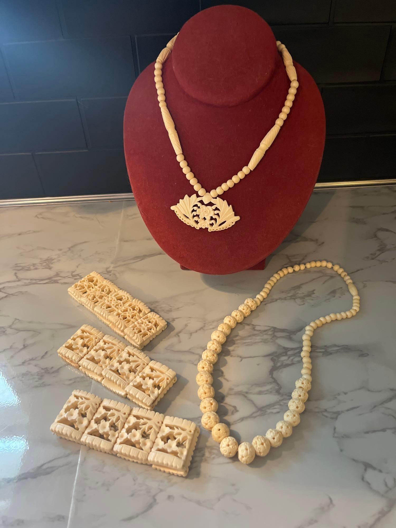 5-Piece Carved Bovine Bone Jewelry: A five-piece collection of hand-carved bovine bone jewelry featuring intricate openwork floral and geometric motifs. The material exhibits characteristic natural pitting and canaliculi, and lacks the
