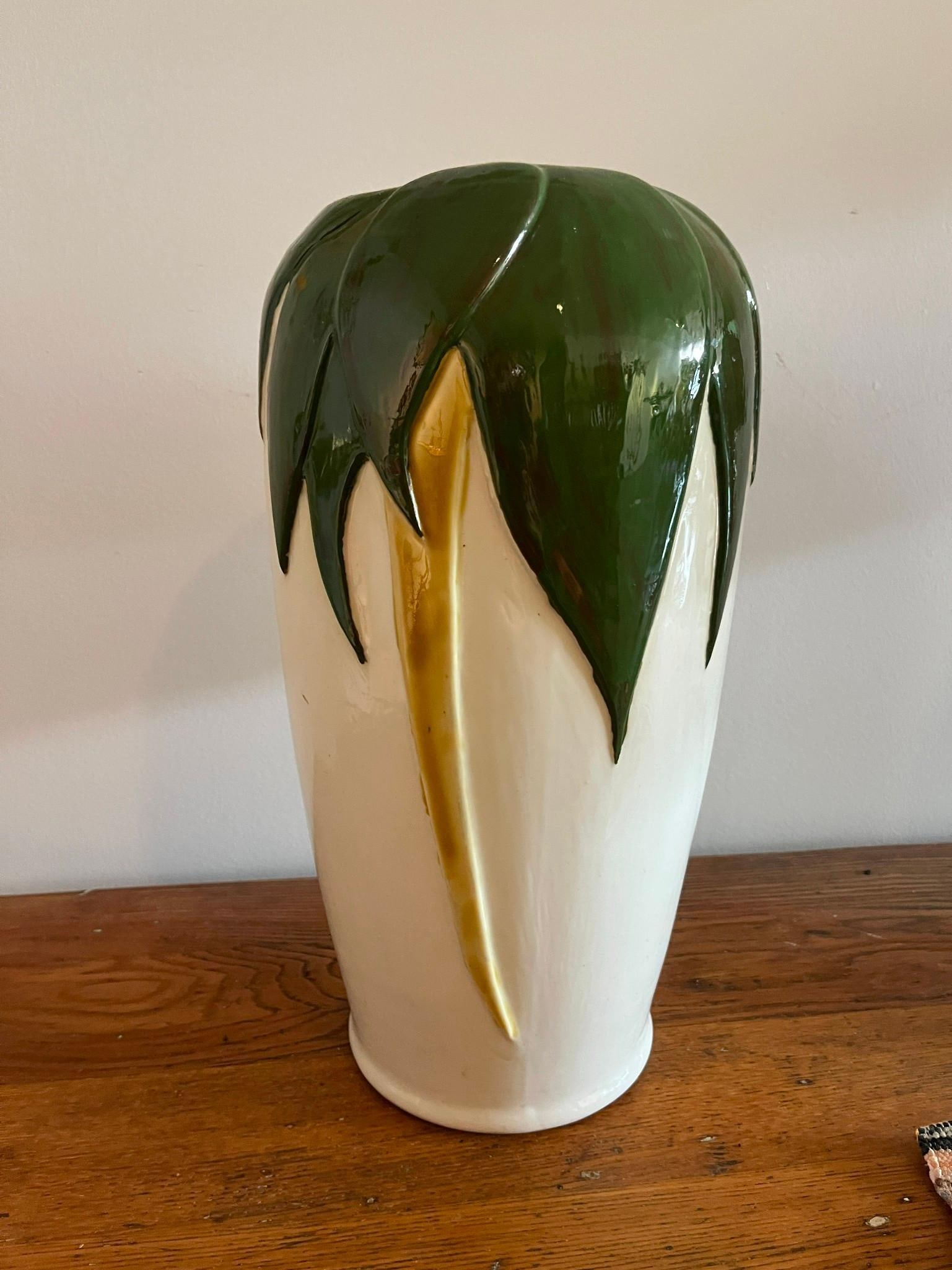 Botanical Relief Earthenware Vase: A large glazed earthenware vase of tall, tapered form with a rounded shoulder and slightly flared base. The vessel features a high-gloss cream-white body decorated with relief-molded botanical motifs.