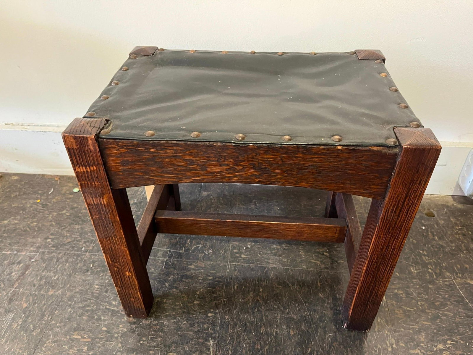 American Mission Quartersawn Oak Stool: An American Arts and Crafts style footstool constructed from quartersawn oak with a dark stained finish. The stool features square-section legs topped with decorative pyramidal caps that extend above 