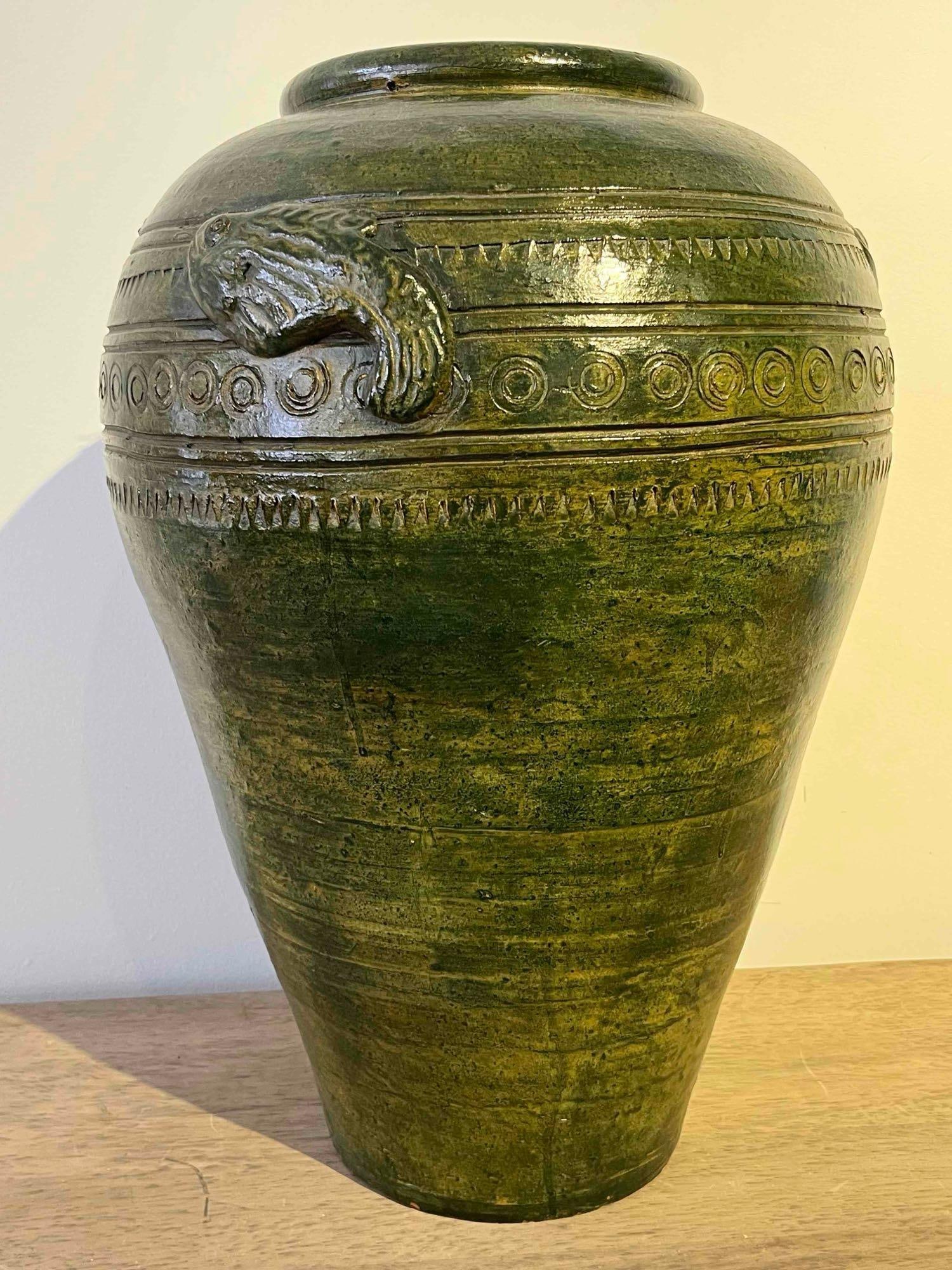Southeast Asian Jar w/ Fish, Green: This large ceramic jar is a functional storage vessel of Southeast Asian origin, likely from Myanmar or Northern Thailand. The piece features a characteristic ovoid body with a short, tapered neck and