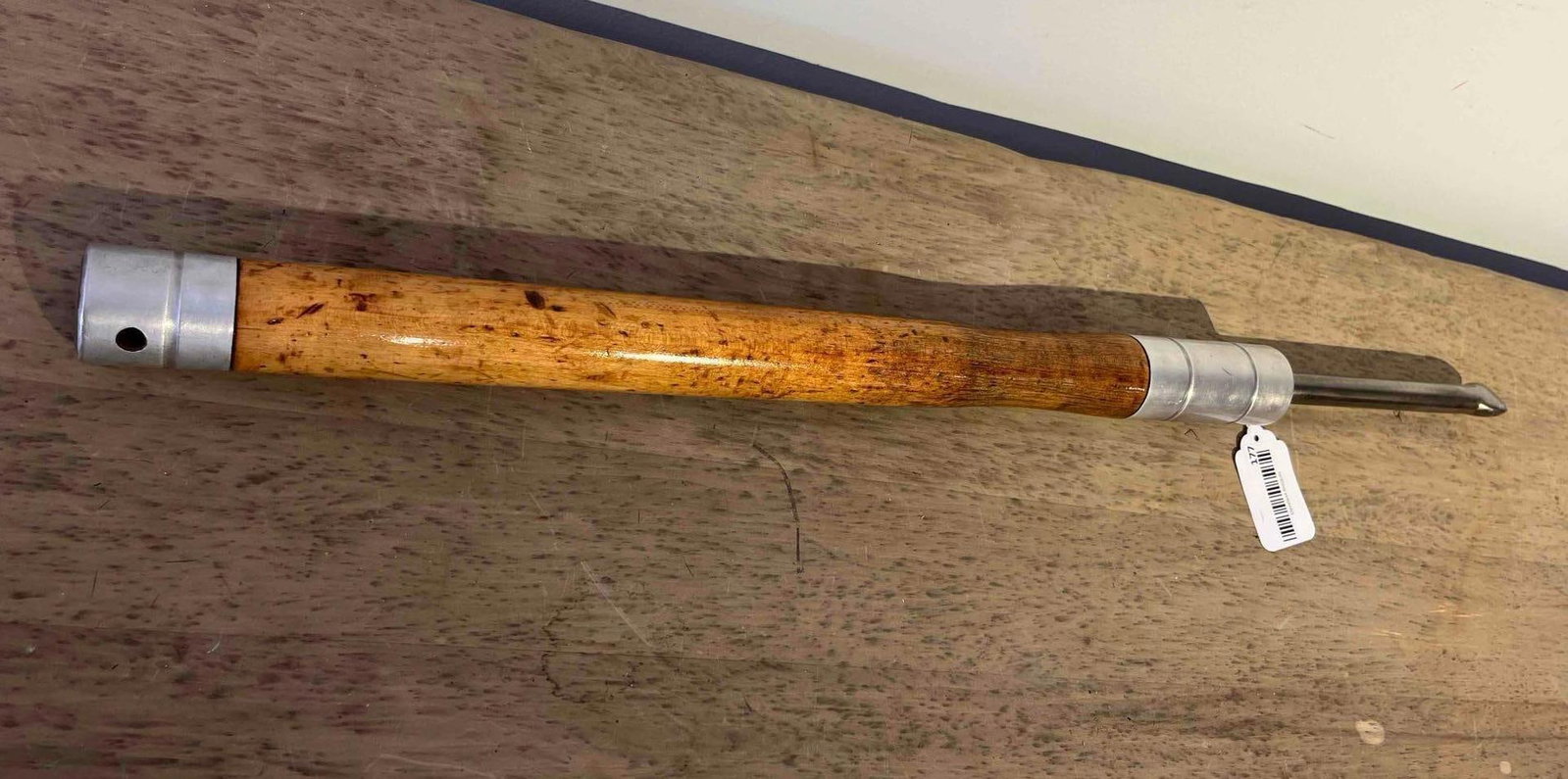 Woodturning Spoon-Nose Scraper: A professional woodturning tool designed as a spoon-nose scraper for internal hollowing and finishing of bowls or rounded vessels. The tool features a long, turned hardwood handle with a clear