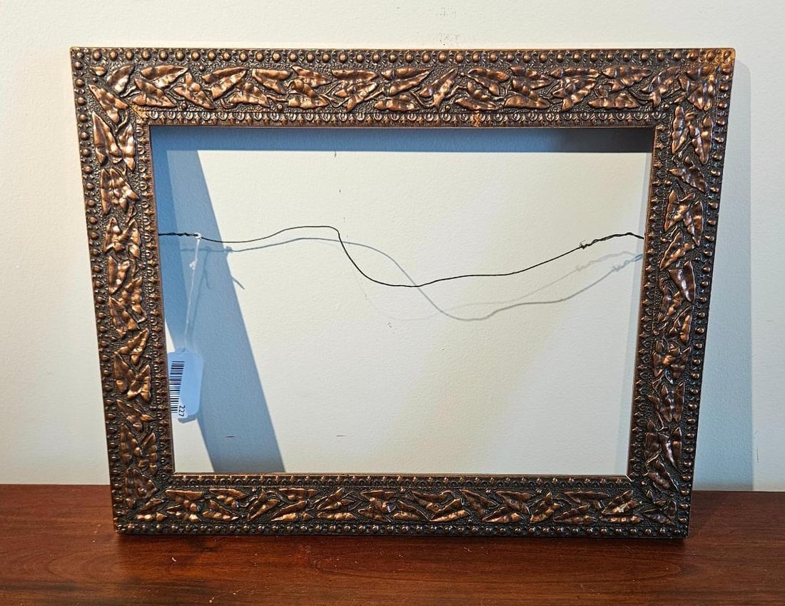 Arts & Crafts Copper Repousse Ivy Frame: A rectangular Arts and Crafts style picture frame featuring a copper repousse or embossed metal overlay on a wooden support. The decorative program consists of a repeating motif of ivy-type leaves and