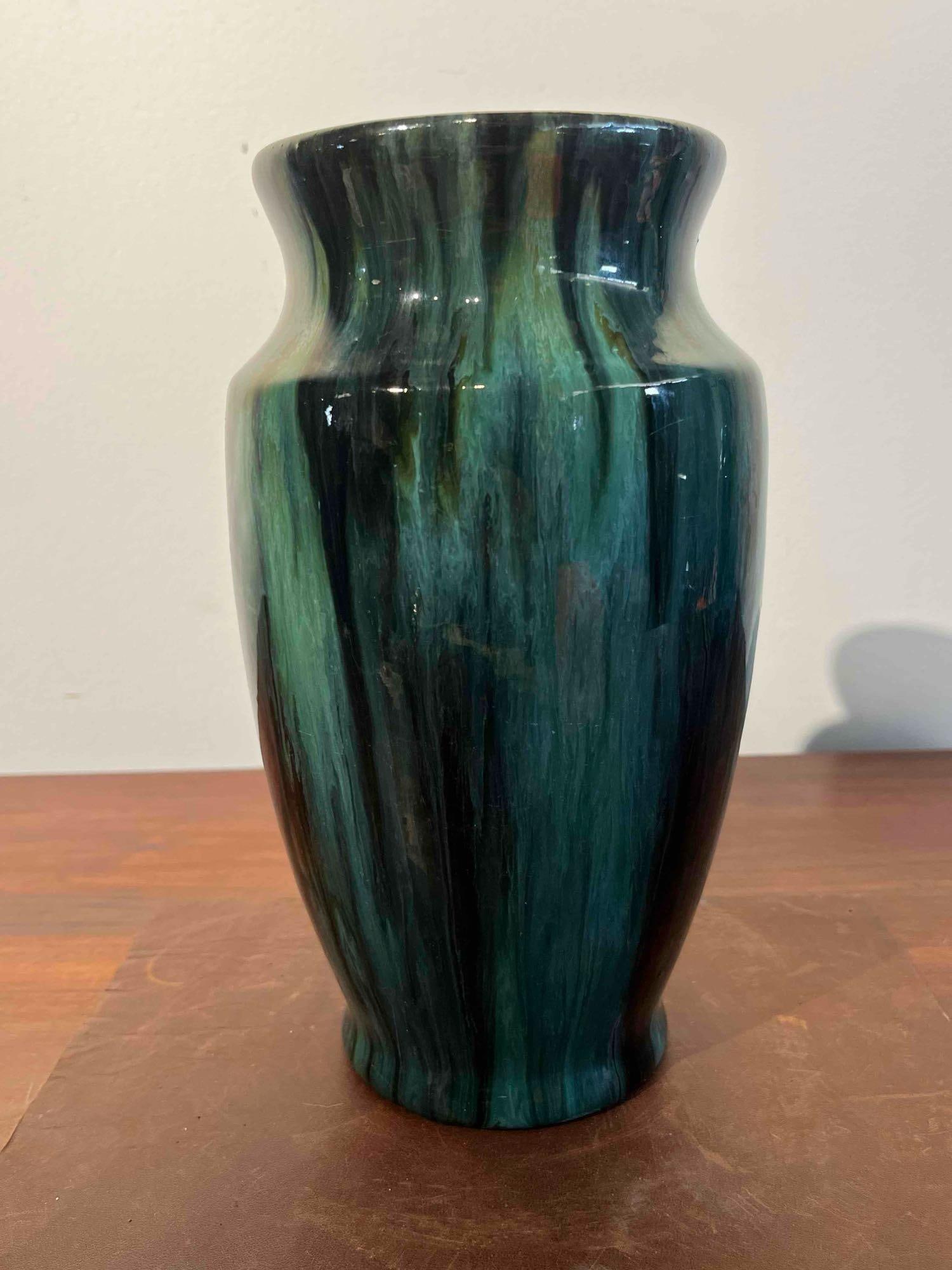 Green & Black Drip Glaze Ceramic Vase: This mid-century modern ceramic vase is crafted from earthenware and features a baluster form with an ovoid body, a waisted neck, a flared rim, and a slightly flared pedestal base. The piece is finish