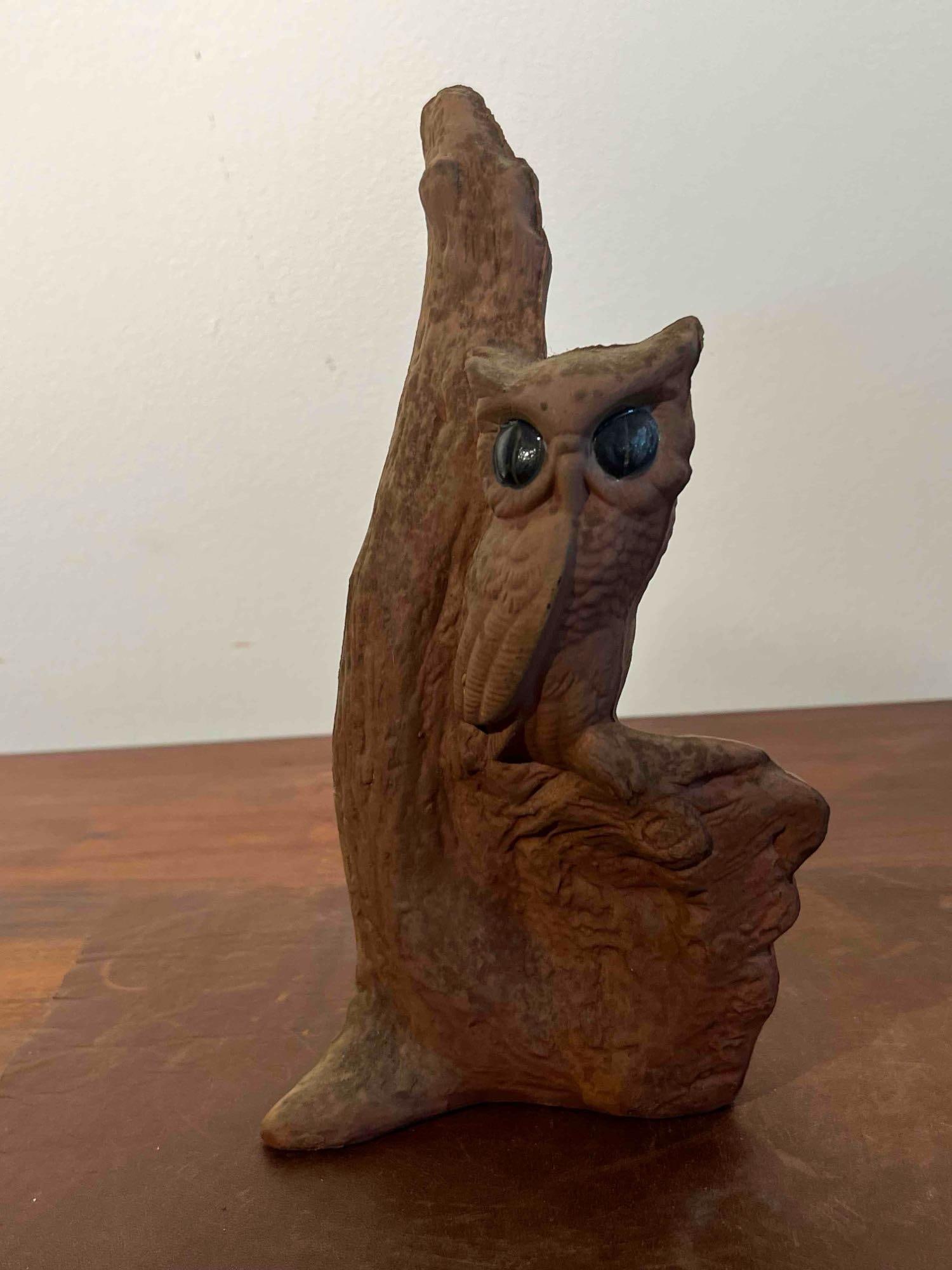 American Textured Ceramic Owl Figurine: An American naturalistic ceramic figurine depicting an owl perched on a textured tree stump. The piece is constructed of hollow-cast ceramic with a matte brown glaze finish designed to simulate the ap