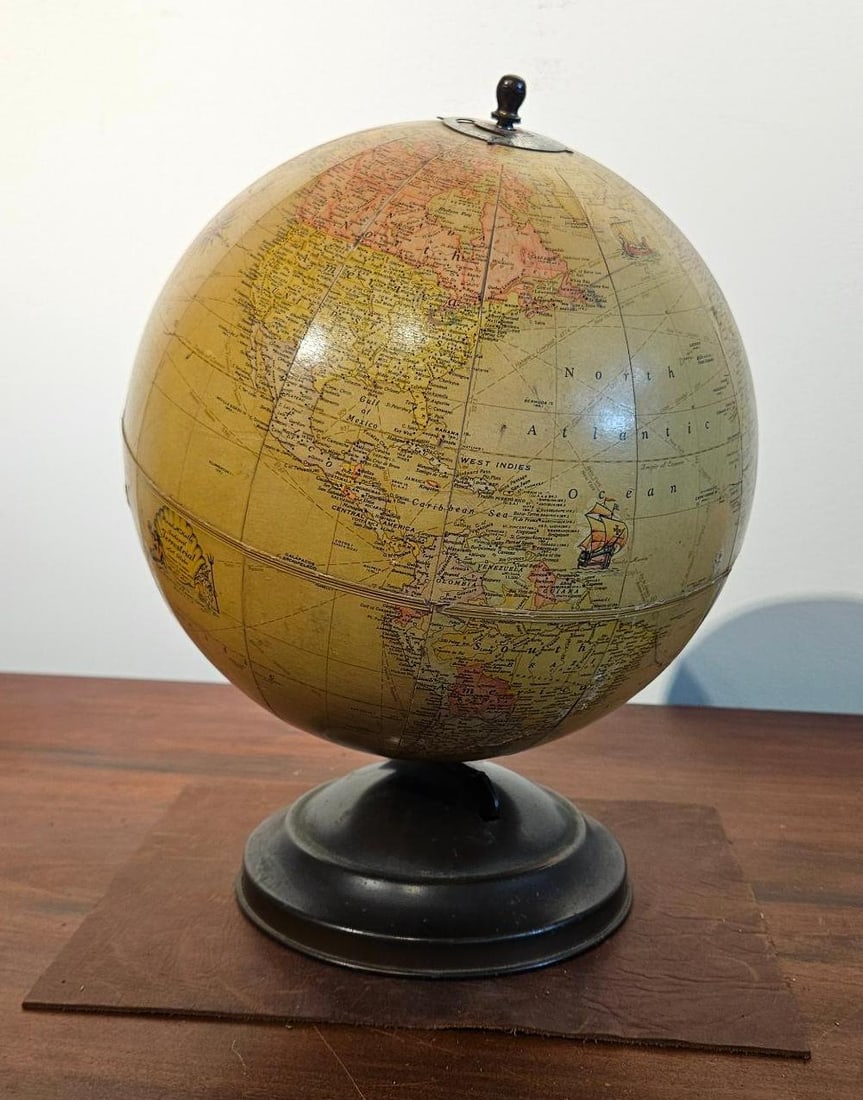 Mid-20th C. Desktop Terrestrial Globe: A desktop terrestrial globe featuring lithographed paper gores applied over a spherical core. The political geography represented dates the piece to between 1932 and 1945, showing borders for