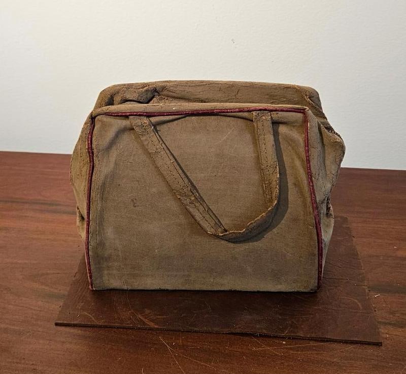 Utility Travel Bag w/ Talon Zipper: A utilitarian zippered bag, suitable for use as a travel kit or small tool bag. The exterior is constructed from a stiffened, heavily distressed olive tan coated canvas or similar fabric featuring