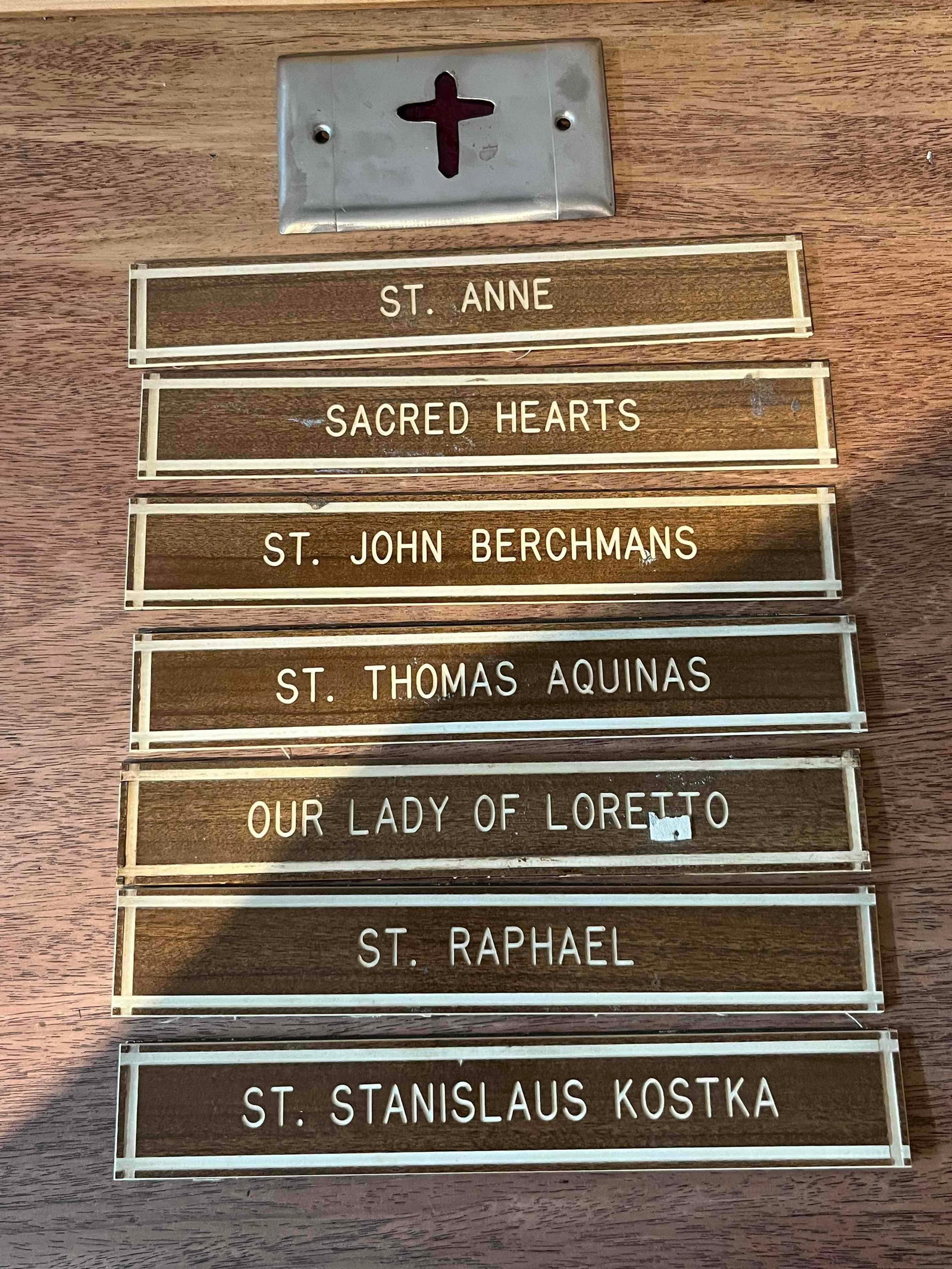 Set 8 Mid-C. Ecclesiastical Sign Plates: An ecclesiastical institutional signage set consisting of one metal indicator plate and seven engraved room nameplates. The indicator plate is constructed of brushed metal, likely aluminum or