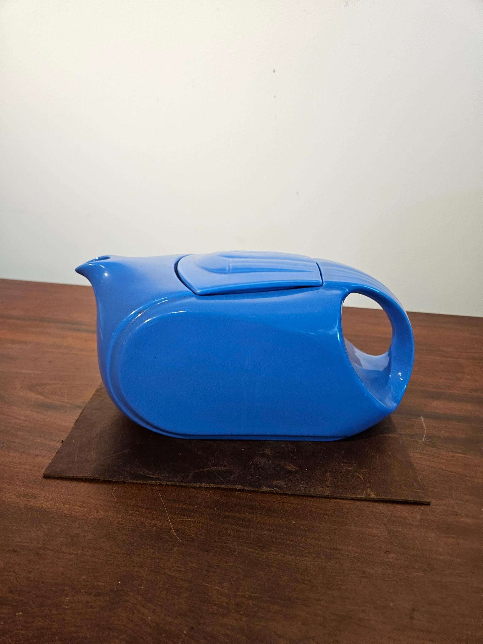 Hall China for Westinghouse Blue Teapot: An American vitrified ceramic teapot designed in the Streamline Moderne style, produced by The Hall China Co. for Westinghouse. The vessel features an elongated, horizontal form with an integrated