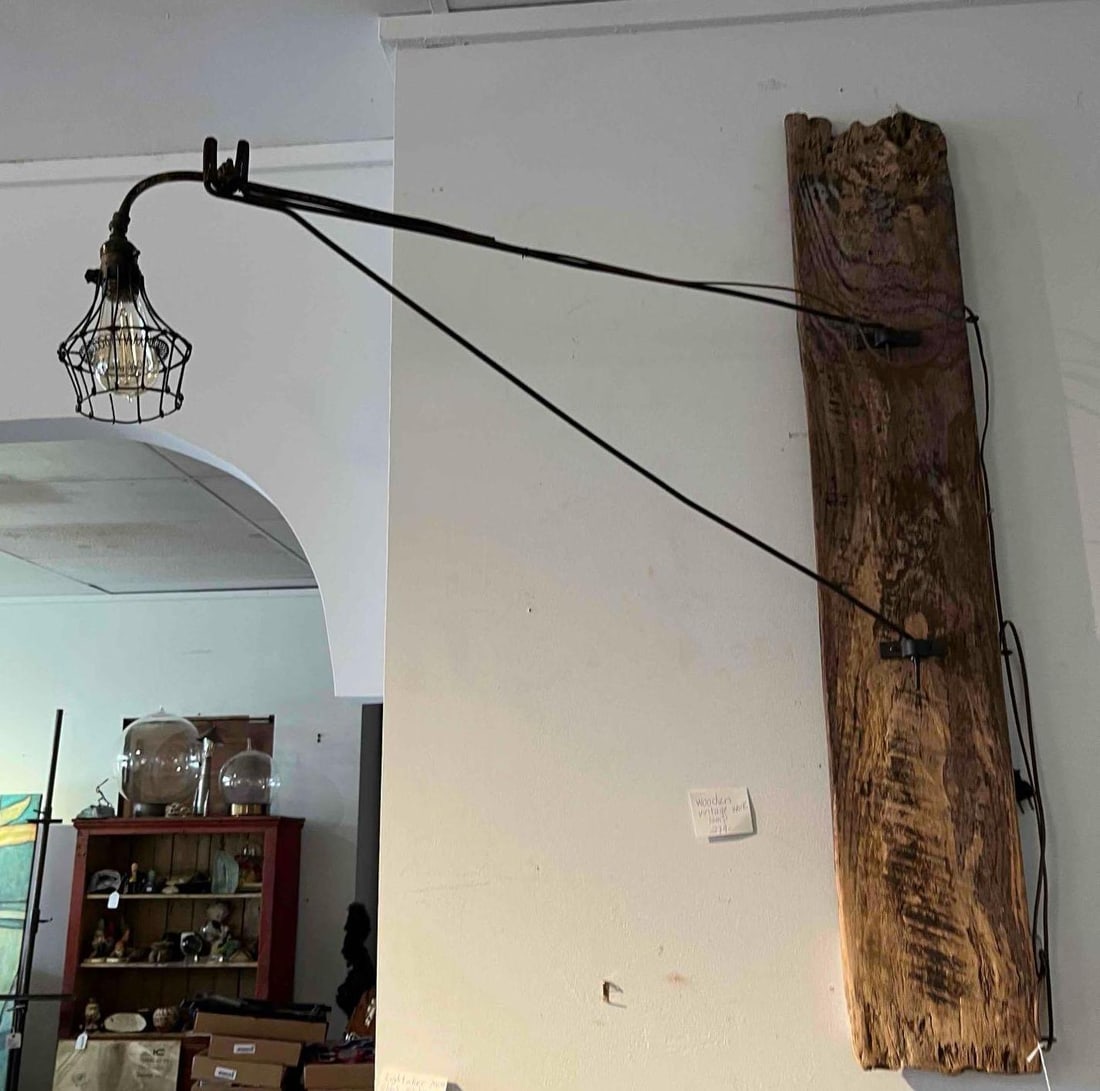 Industrial Wall Swing-Arm Lamp w/ Wood: A large-scale industrial-style wall-mounted swing-arm lamp. The piece features a prominent backplate constructed from a single, thick plank of reclaimed wood characterized by a rough-hewn surface, nat