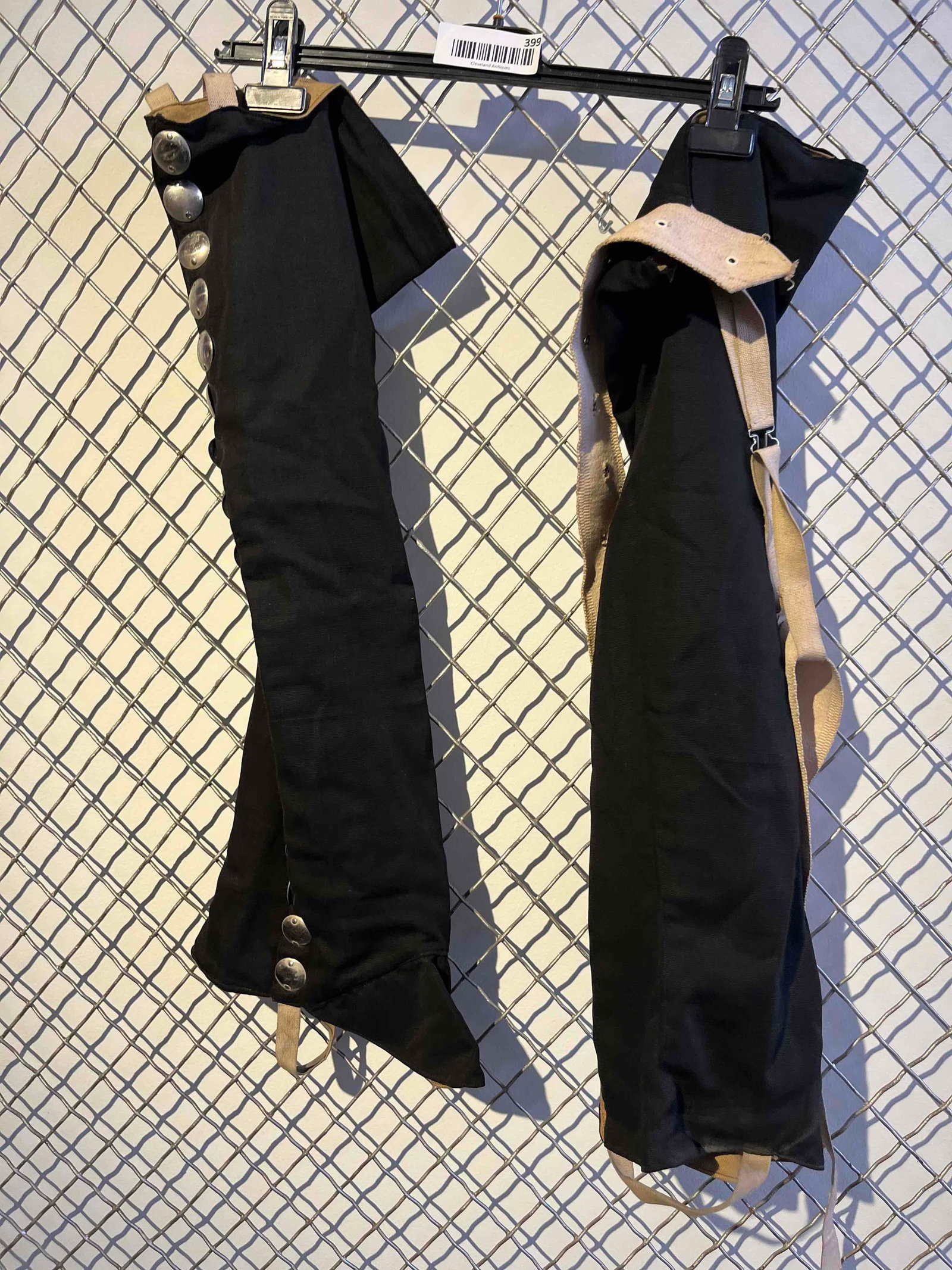 Pair Charro Black Ribbed Cotton Gaiters: This pair of equestrian riding gaiters, commonly referred to as polainas in the Mexican Charro tradition, is crafted from a heavyweight black ribbed cotton fabric, resembling Bedford cord, with a tan 