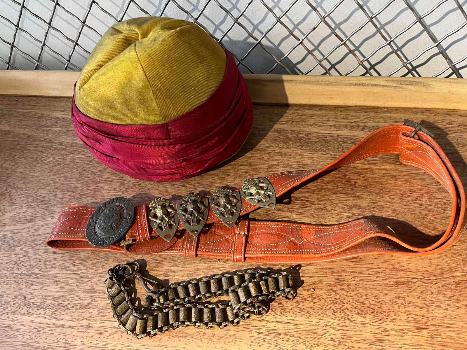 M. C. Lilley Knights Templar Regalia: This group of fraternal regalia belongs to the Knights Templar and is specific to Adrian Commandery No. 4. The set includes a fatigue-style cap, a decorative leather belt with sword hangers, and a met