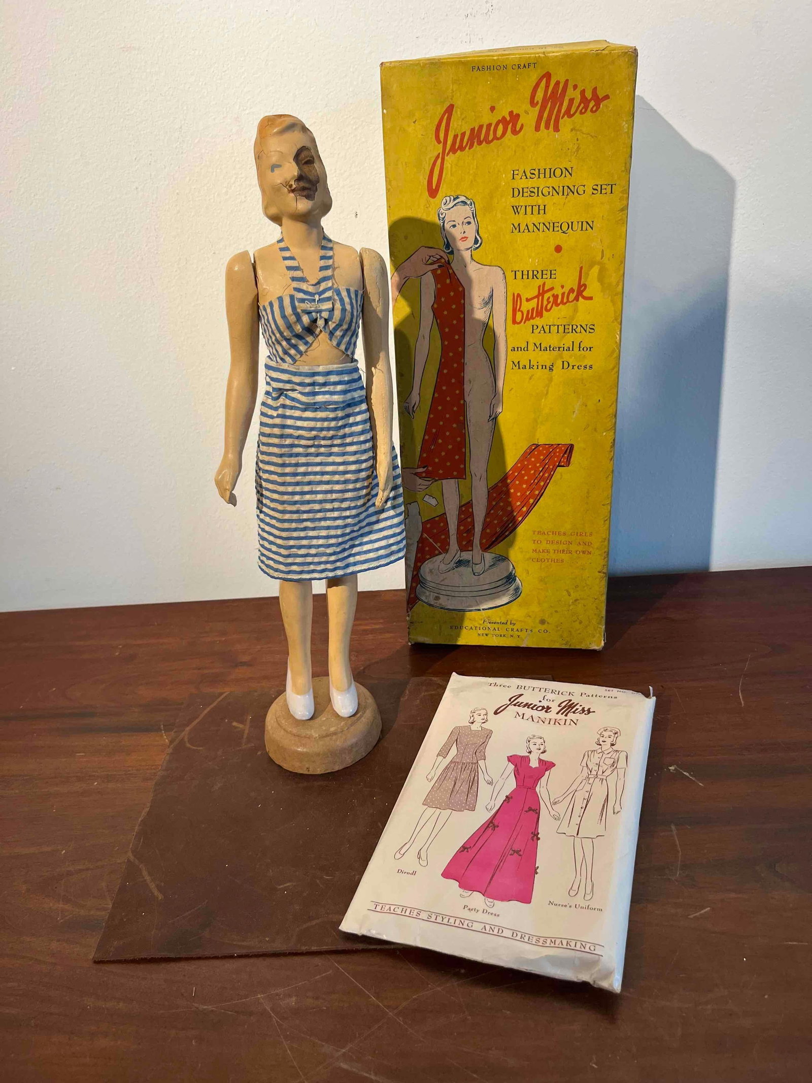 Junior Miss Design Set w/ Mannequin: This fashion design set, titled Junior Miss Fashion Designing Set with Mannequin, was produced by Fashion Craft and presented by the Educational Crafts Co. of New York, N.Y. The set includes a