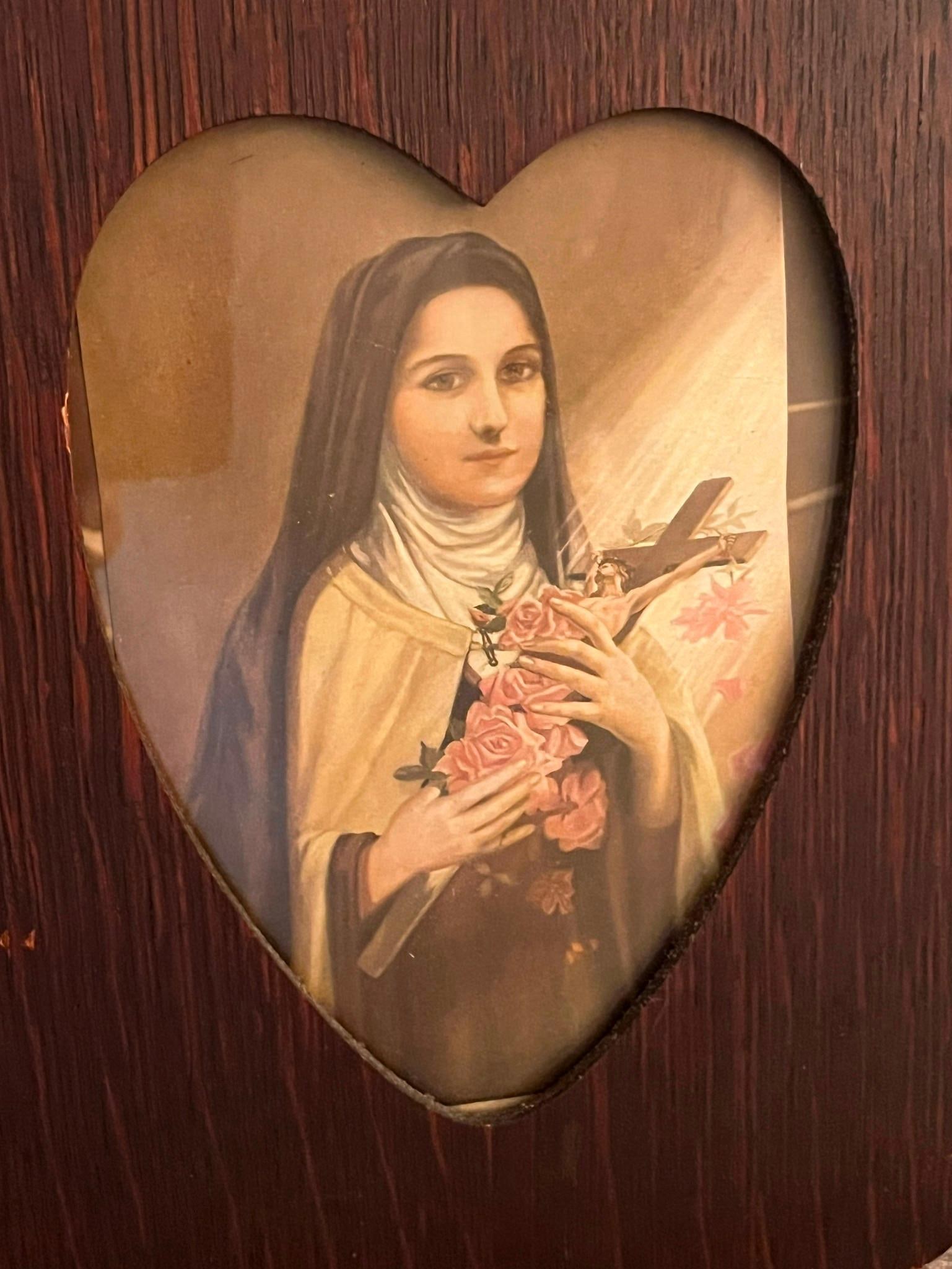 Saint Therese of Lisieux Lithograph: This color lithograph depicts Saint Th?r?se of Lisieux, a Carmelite nun traditionally known as The Little Flower. The subject is portrayed in her brown habit with a white wimple and cream-colored mant