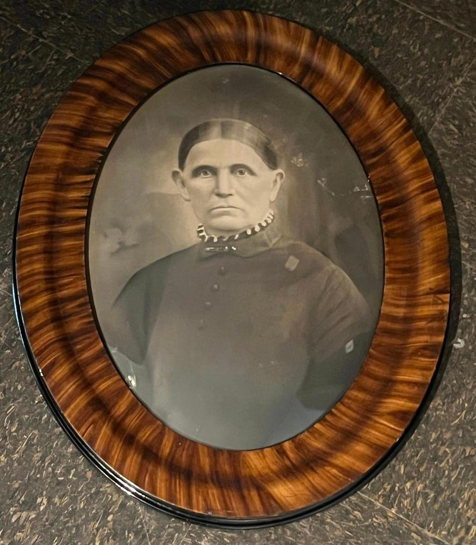 Crayon Portrait Woman, Oval Maple Frame: This late nineteenth to early twentieth-century bust-length portrait is a solar enlargement, a photographic process where a faint image was projected onto paper and then meticulously enhanced by hand 