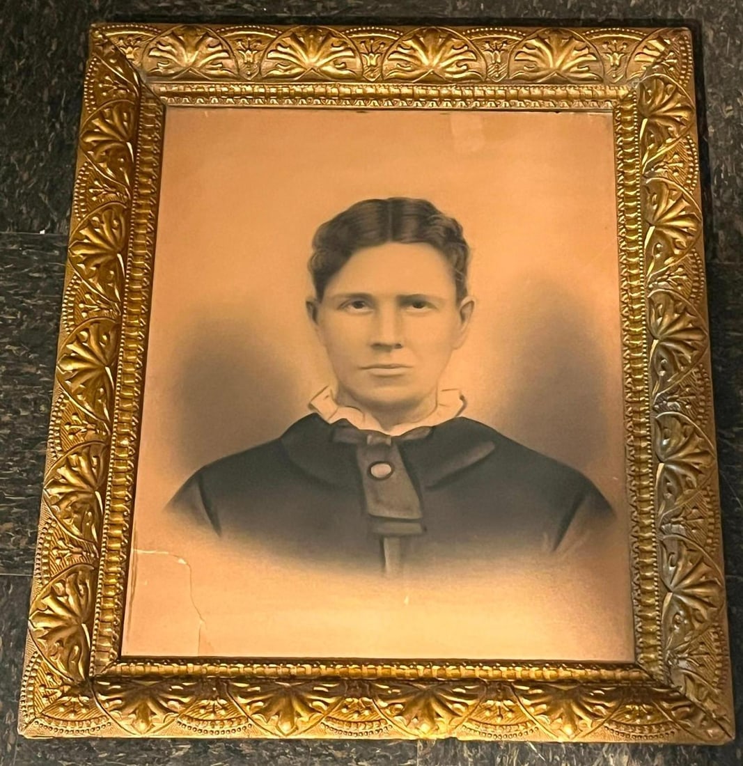 American School, 19th C. Woman Portrait: This late 19th-century crayon portrait is rendered in charcoal and pastel over a light photographic base on toned paper. The subject is a woman shown in a chest-length view, facing forward. Her dark h