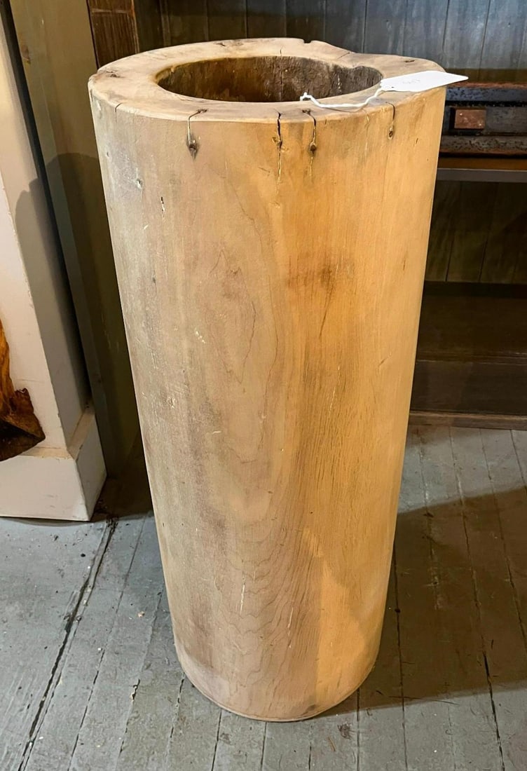 Primitive Wood Trunk Vessel w/ Iron: A large primitive vessel crafted from a single hollowed section of a tree trunk. The piece features a light, bleached wood finish that highlights the natural swirling grain, knots, and textures of the