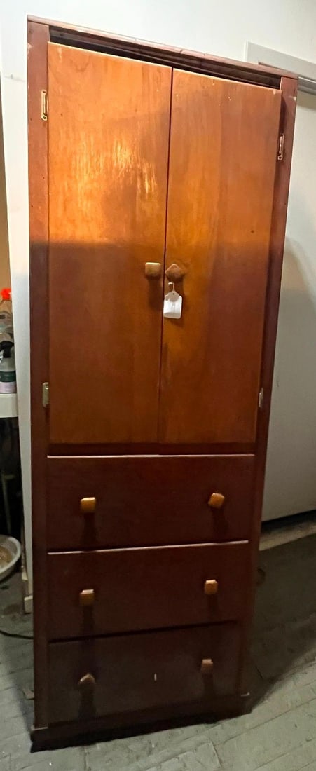 American Mid-Century Cabinet w/ Drawers: A tall, narrow storage cabinet of single-piece construction, likely of mid-20th-century American origin. The unit is crafted from stained wood, with interior panels and drawer bottoms exhibiting a
