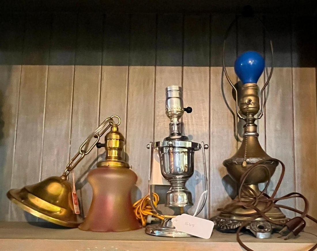 Brass & Glass Pendant & 2 Table Lamps: This lot comprises a trio of lighting fixtures consisting of one hanging pendant and two table lamps. The pendant light features a brass-finished metal ceiling canopy and an oval-link chain connected 