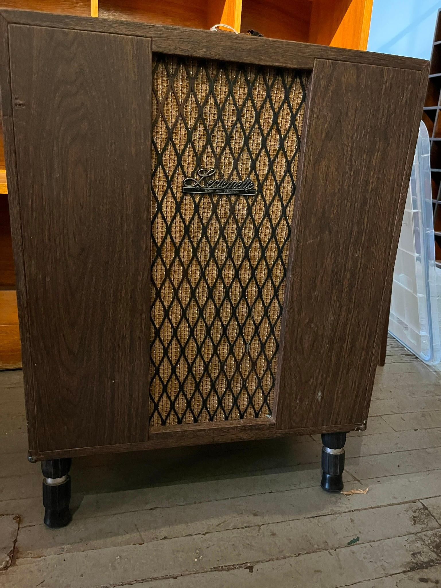 Sound-Craft Systems Lecternette PA: A portable public address amplifier and speaker unit manufactured by Sound-Craft Systems, Inc. of Morrilton, Arkansas. The cabinet is finished in a dark wood-grain laminate and is supported by four