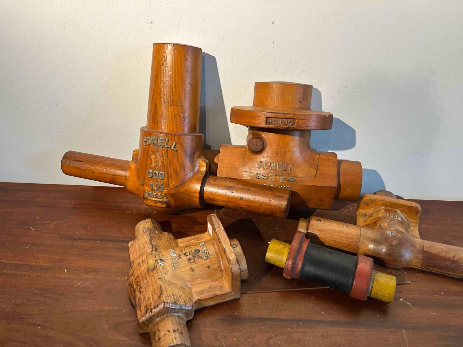 Powell Company Wood Valve Patterns (5): This collection consists of five wooden foundry patterns used to create sand molds for casting industrial valve components. Manufactured by The William Powell Company of Cincinnati, Ohio, the pieces