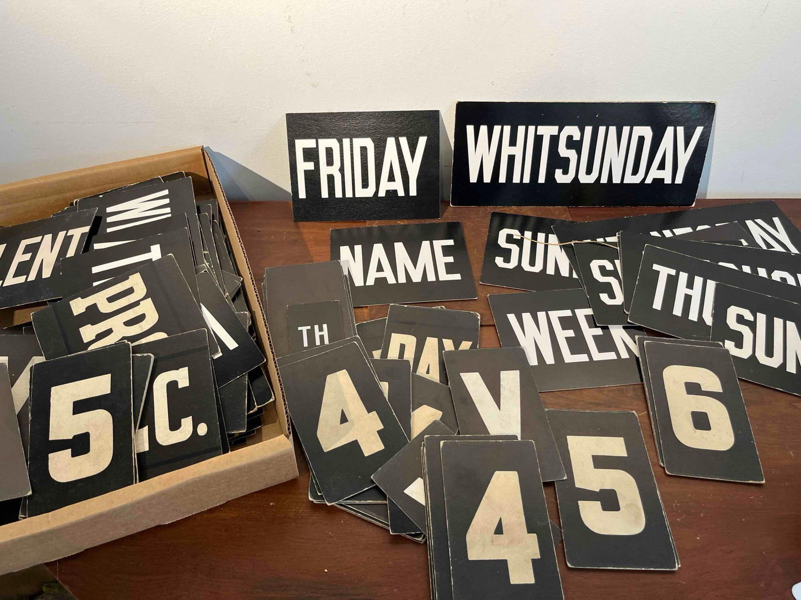 Church Hymn & Announcement Inserts: An assortment of mid-20th century liturgical and calendar sign inserts. The collection is constructed from heavy black cardstock with white printed bold, block-style typography. The set includes