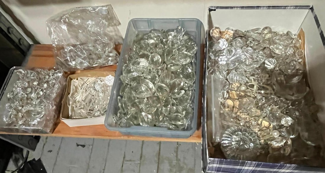 Crystal Chandelier & Lighting Parts: An assortment of clear glass or crystal components intended for chandelier and lighting fixture restoration or assembly. The collection features a wide variety of shapes and sizes, including faceted p