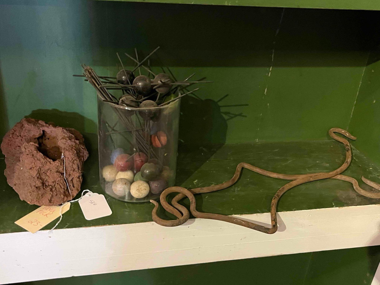 Trio: Lava Rock, Spikes & Iron Hay Hook: This lot features three distinct items categorized by their natural and rustic qualities. The natural history specimen is a piece of reddish-brown lava rock, specifically scoria or vesicular basalt,