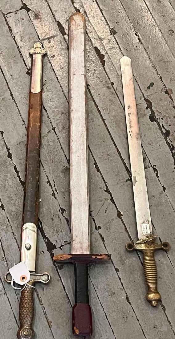 3 19th C. Style Artillery & Wood Waster: This collection includes two cast brass hilt short swords and one wooden training waster. The first sword follows the United States Model 1832 Foot Artillery pattern, featuring a solid brass hilt