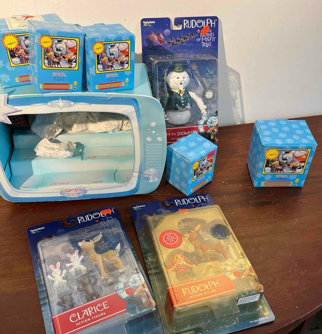 Playing Mantis & Enesco Rudolph Figures: A collection of holiday-themed collectibles based on the Rankin/Bass television special Rudolph the Red-Nosed Reindeer. The lot features items from several manufacturers including Playing Mantis, ToyS