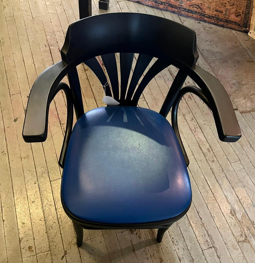 Black Bentwood Fan Back Armchair, Vinyl: A single bentwood armchair constructed from black-painted hardwood. The chair features a distinctive fan-shaped back with a wide, curved crest rail supported by five flat, radiating splats. Broad,