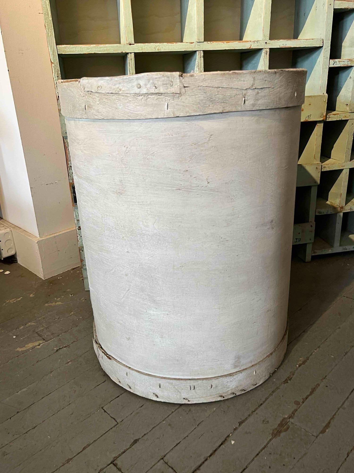 Painted Primitive Bentwood Barrel: A large primitive bentwood dry goods storage container of cylindrical form. The body is constructed from a single sheet of bent wood joined at a vertical seam with metal fasteners. The top and bottom