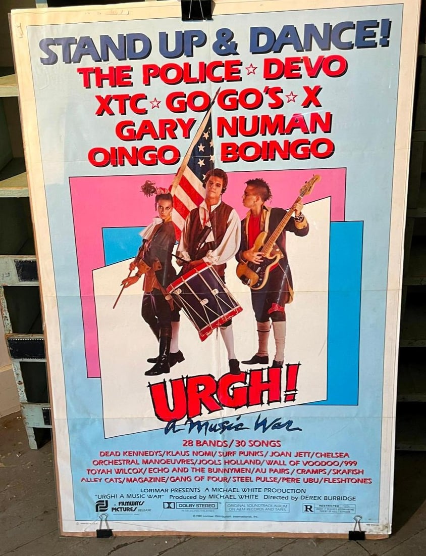 1981 Urgh A Music War One-Sheet Poster: This is an original theatrical one-sheet movie poster for the 1981 concert documentary Urgh! A Music War. The poster features a central graphic depicting three performers in stylized 18th-century revo