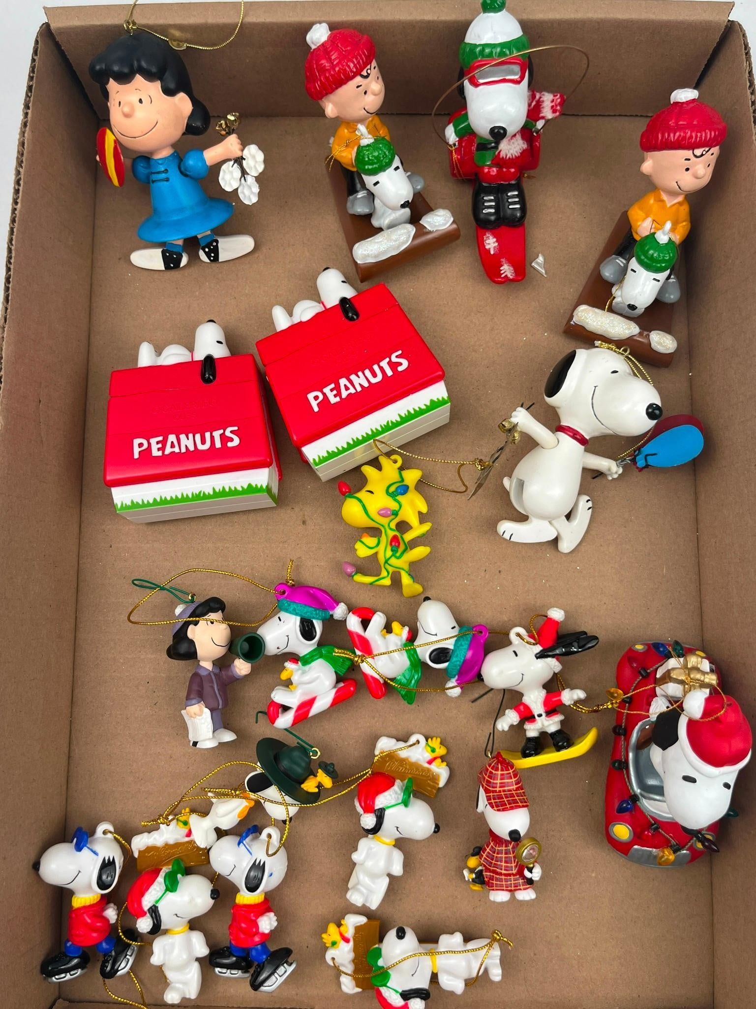 Peanuts & Galerie Holiday Ornaments: This group of holiday ornaments features characters from the Peanuts comic strip, including Snoopy, Charlie Brown, Lucy van Pelt, and Woodstock. The pieces are constructed from molded PVC plastic.