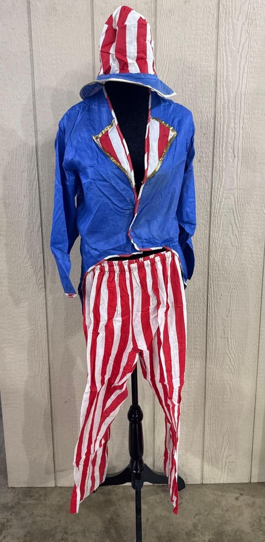 Uncle Sam Patriotic Costume Trio: A three-piece Uncle Sam costume comprising a jacket, trousers, and a stovepipe hat. The ensemble is constructed from a lightweight, textured fabric with a crinkle finish, likely a cotton-synthetic ble