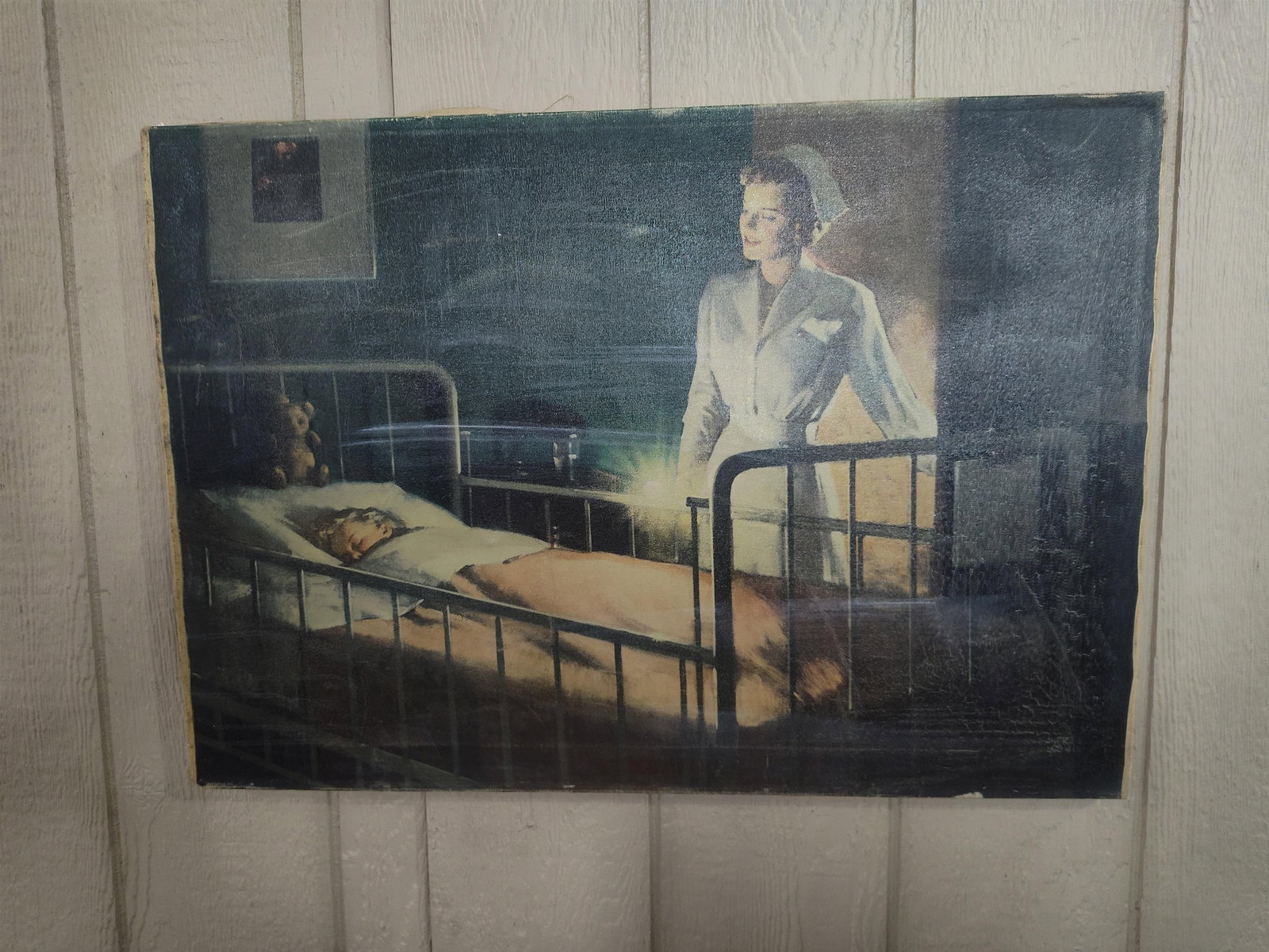 Andrew Loomis O/C Nurse & Child: This original oil painting on stretched canvas is by the American illustrator Andrew Loomis. The work depicts a nurse in a crisp white uniform and cap standing at the bedside of a sleeping child. The