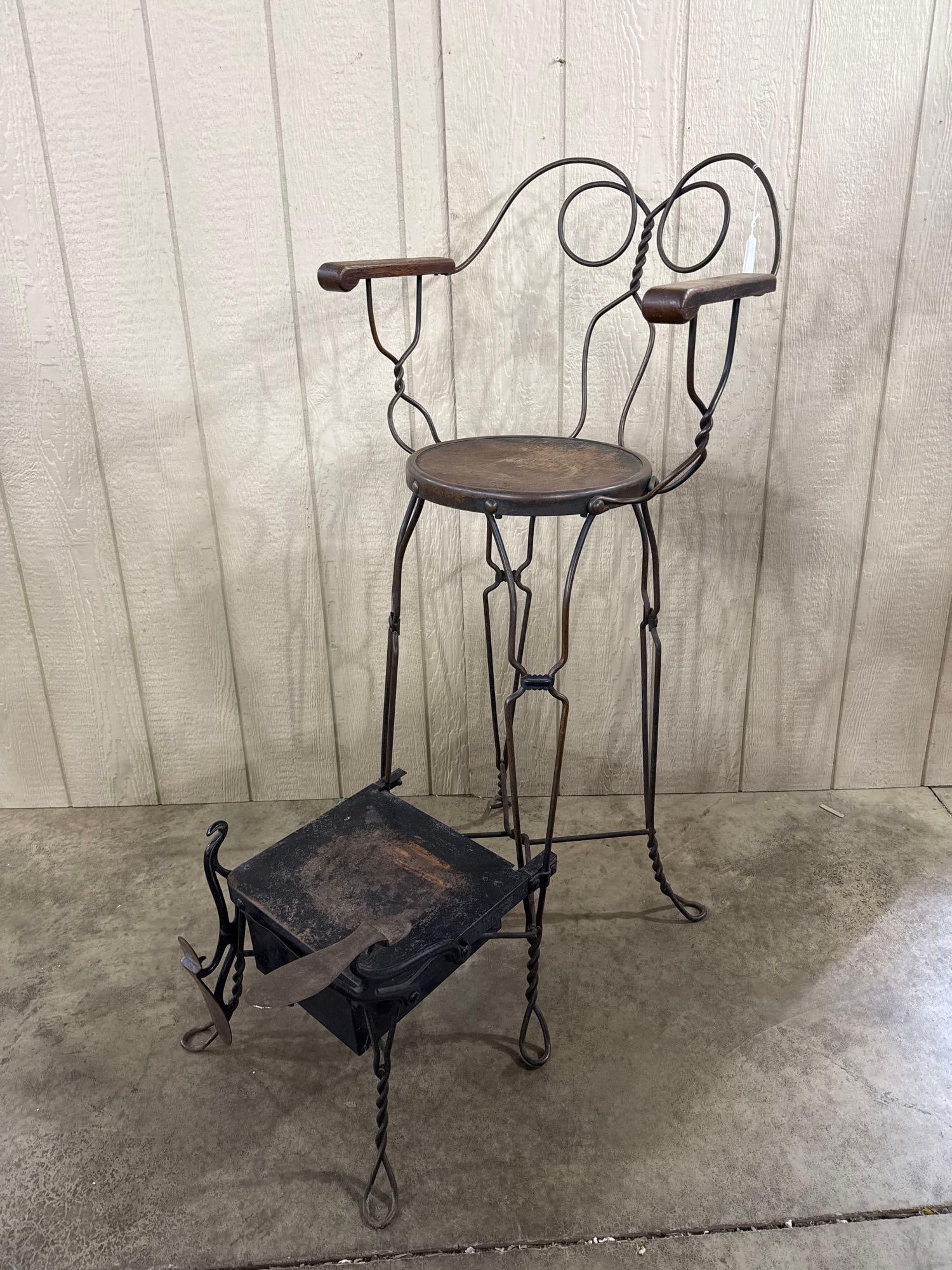 Iron & Wood Shoeshine Chair w/ Drawer: This professional shoeshine chair features a tall stool-height armchair design constructed from wrought iron with decorative twisted wire supports. The chair is fitted with a circular wooden seat and