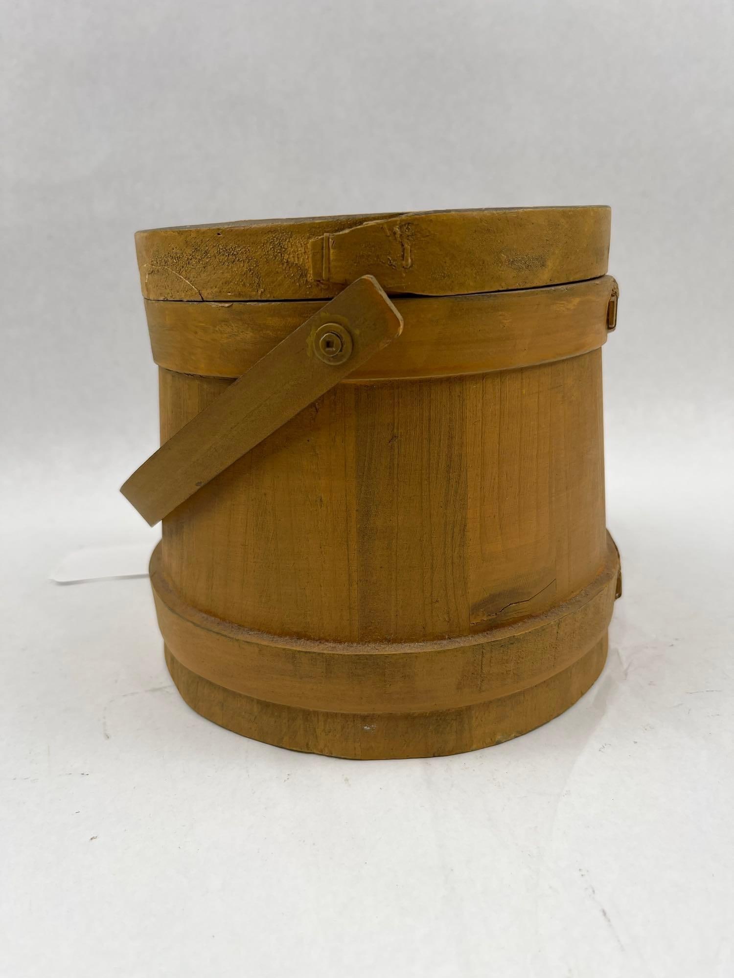 Mustard Painted Stave Firkin w/ Lid: A small, stave-constructed wooden bucket, commonly referred to as a firkin, featuring a mustard-yellow painted finish. The vessel is constructed with vertical wooden staves secured by two horizontal w