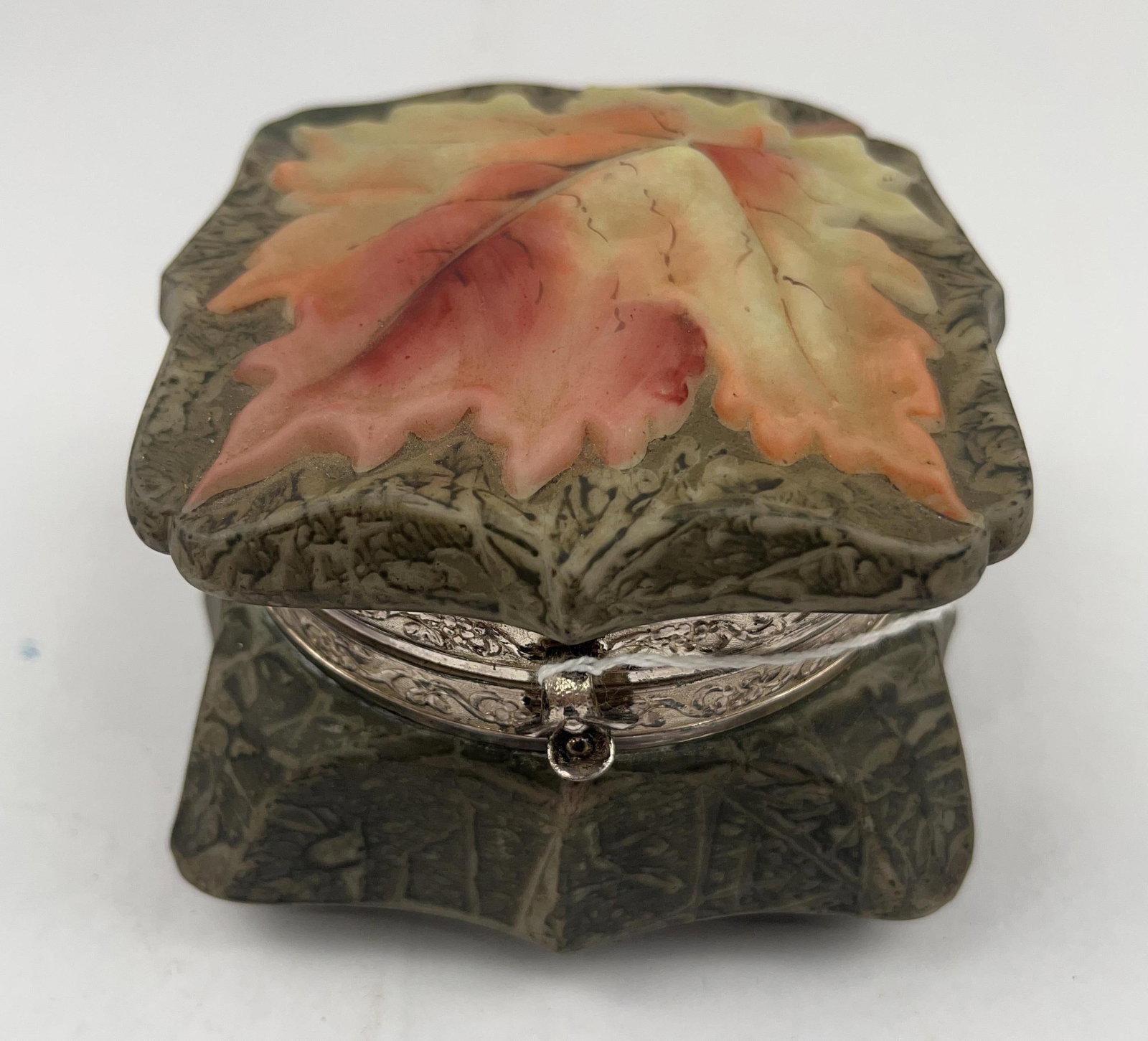 Nakara Art Nouveau Maple Leaf Glass Box: An Art Nouveau trinket box crafted from opaque white glass with a matte finish. The square-bodied vessel features a hinged lid with a high-relief molded maple leaf motif, hand-painted in autumnal