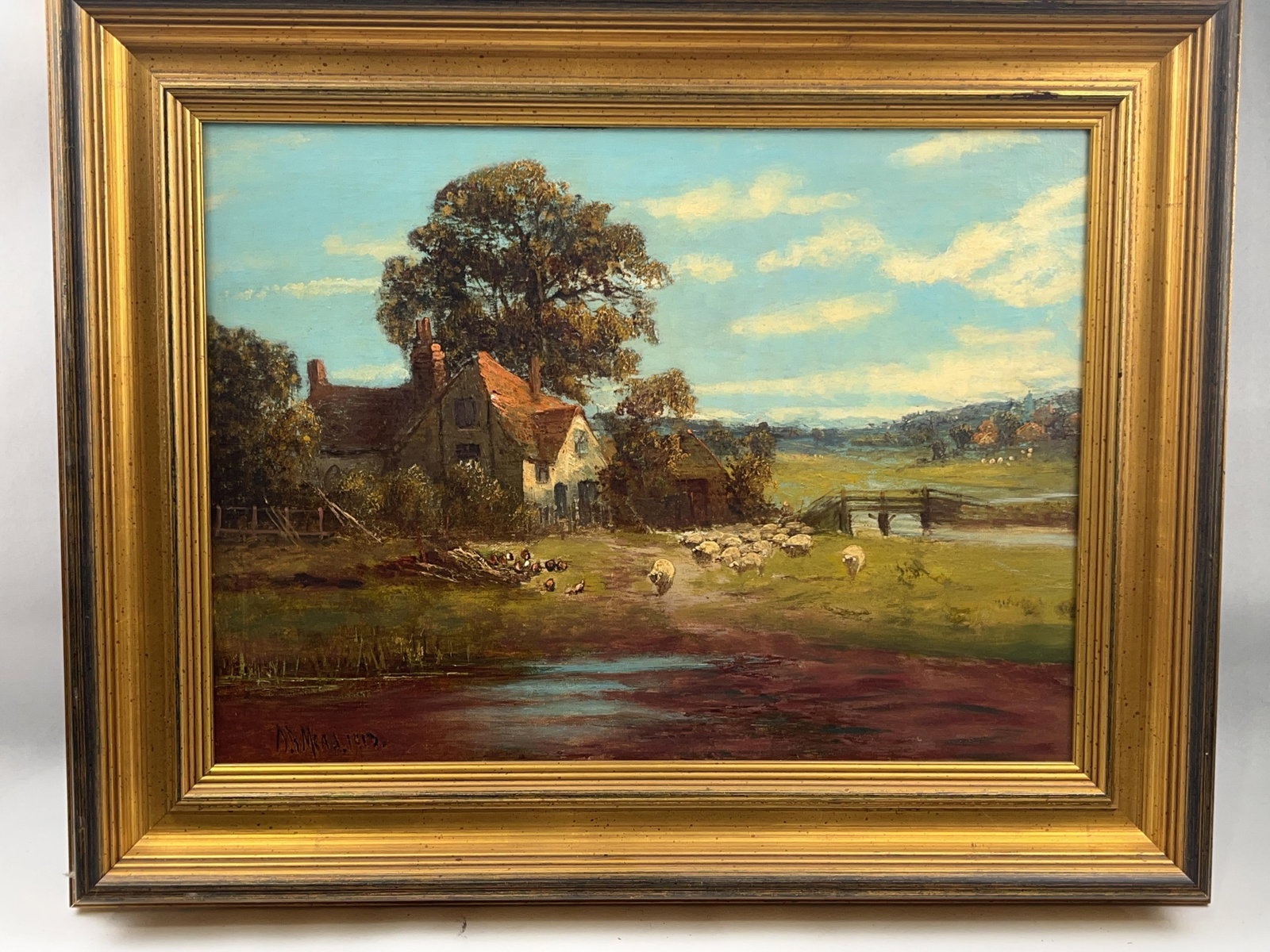 D.B. Murray (1913) Pastoral Landscape: An oil on stretched canvas landscape painting by D.B. The composition depicts a tranquil rural scene with a rustic, red-tiled cottage nestled beneath a large, leafy tree. Murray, dated 1913.