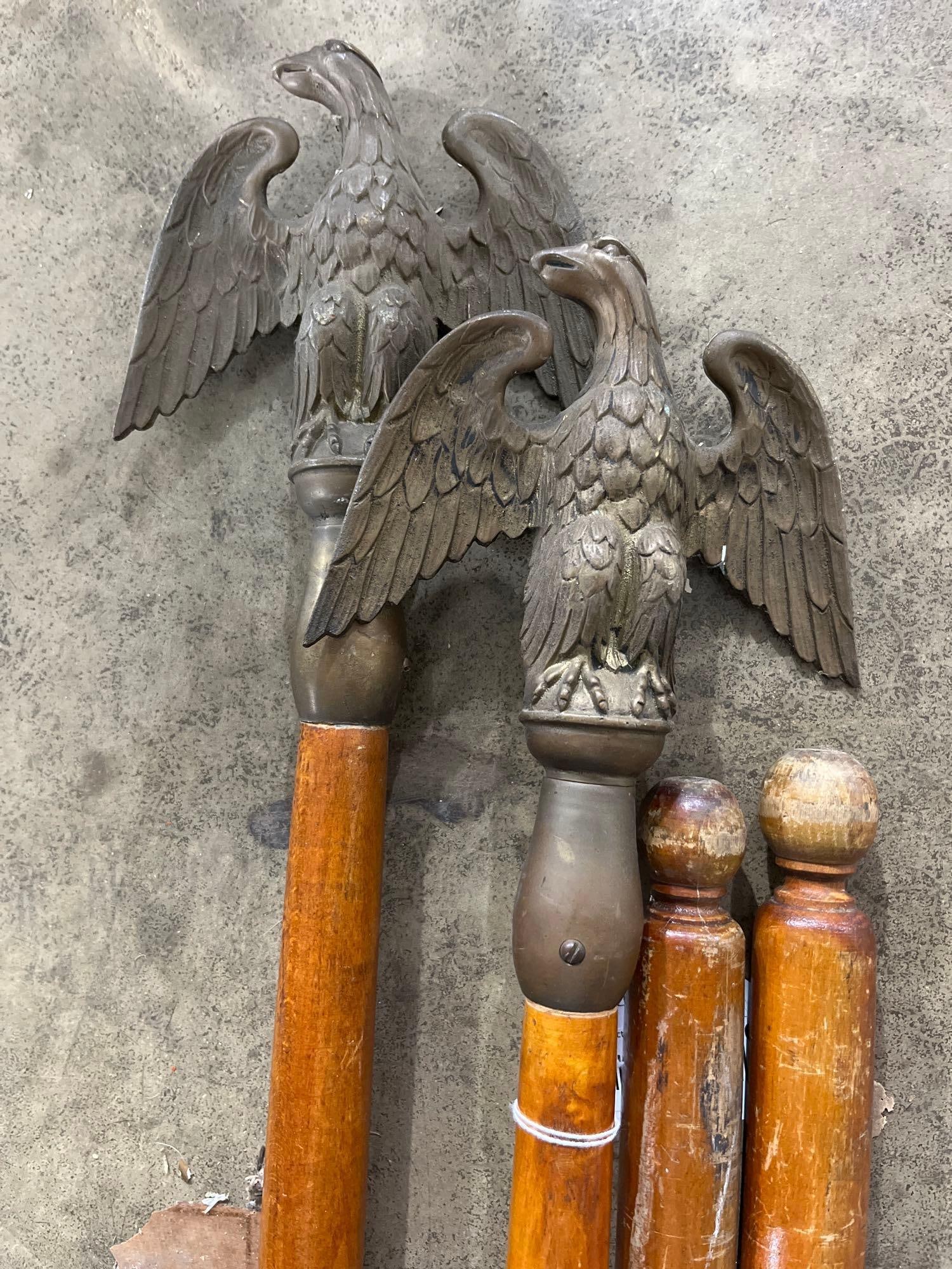 American Flagpole Eagle & Ball Finials: This collection comprises various components for indoor or parade flagpoles, featuring two cast brass or bronze finials in the form of the American spread eagle. The eagles are mounted atop tapered