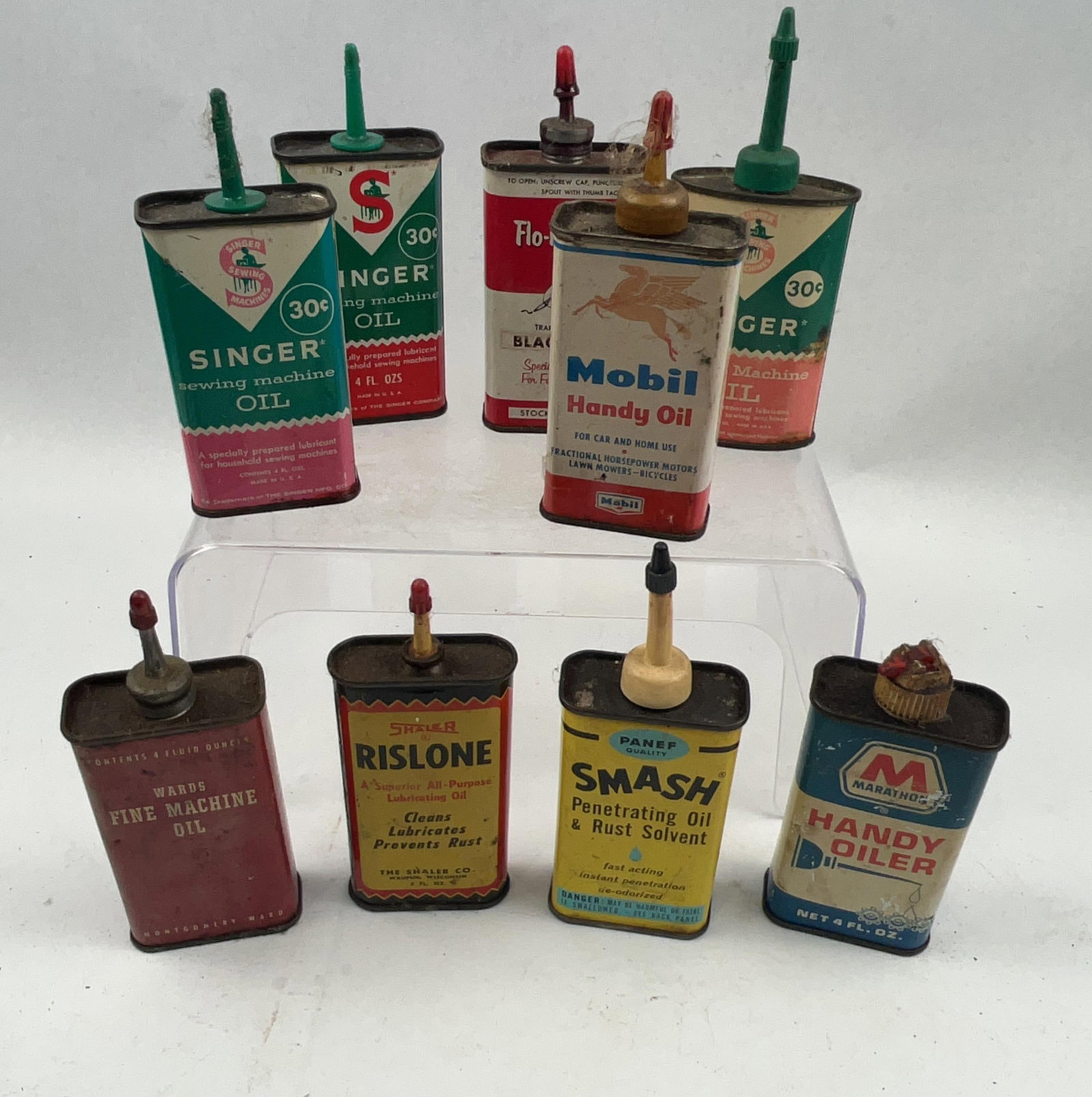 Vtg Mobil, Singer & Marathon Tins: An assortment of eight vintage lithographed tin containers designed for light machine oils, specialty lubricants, and ink. The Mobil Handy Oil tin features a white, red, and blue design with a red