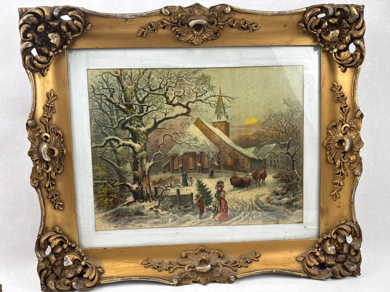 J. Parker Church Scene Chromolithograph: A chromolithograph depicting a Victorian winter landscape featuring a snow-covered church at dusk. The scene includes various figures in period attire, a horse-drawn sleigh, and a child carrying a