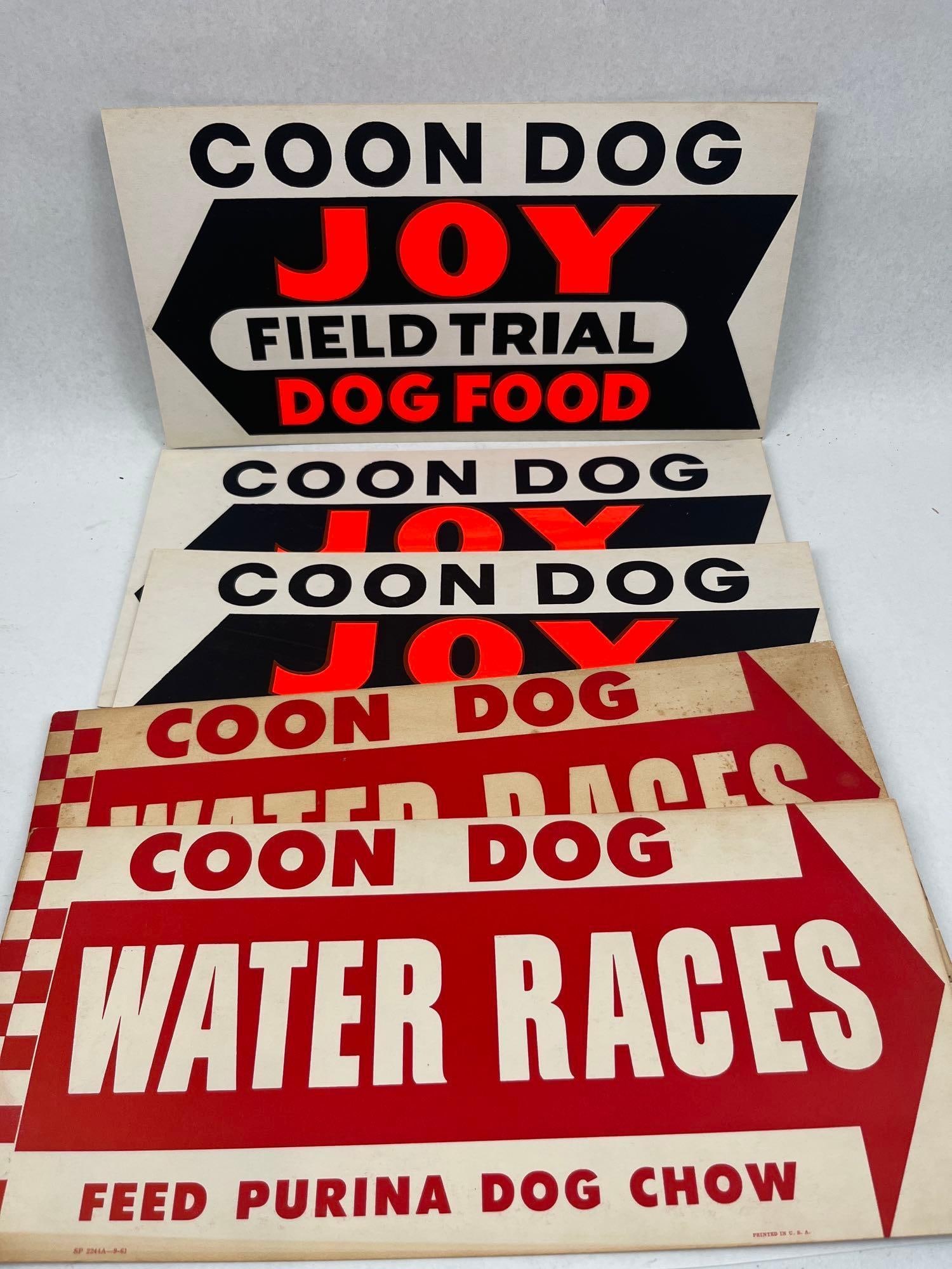 Joy & Purina Coon Dog Signs: This collection consists of several vintage lithographed paperboard directional advertising signs related to coon hunting events and dog food. The assortment includes two distinct graphic designs.