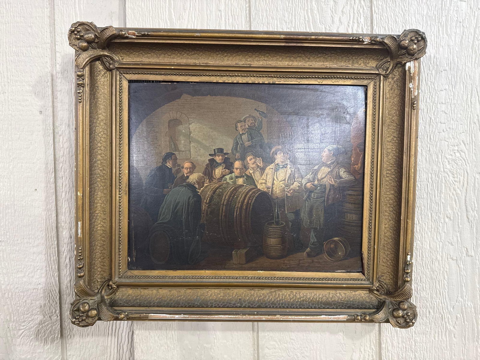 19th C. Tavern Interior, Oil on Panel: This 19th-century oil painting on panel depicts a tavern or wine cellar genre scene. The composition features a group of men in period attire, including waistcoats, cravats, and hats, gathered around