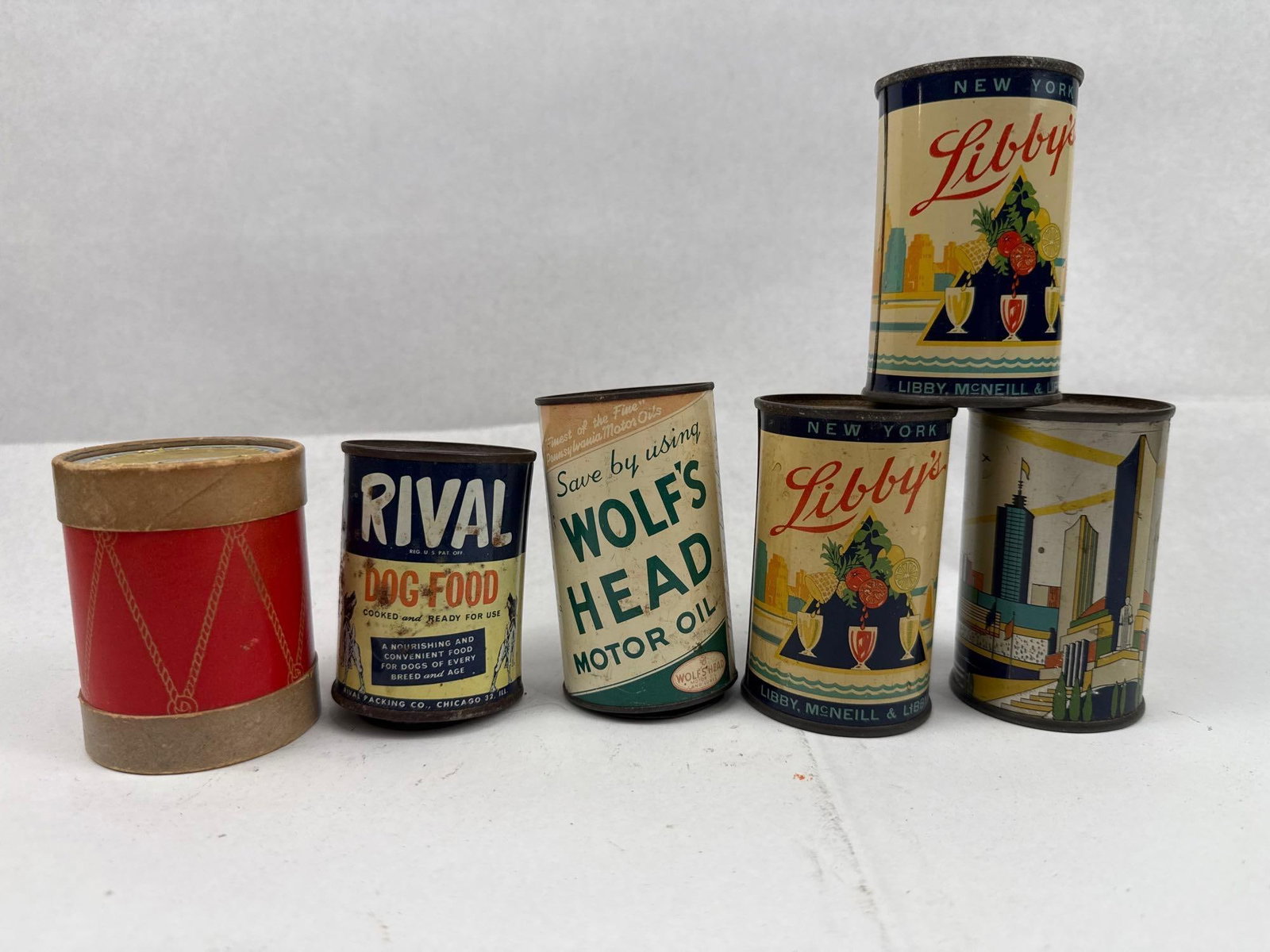 Tin Litho Adv & World's Fair Banks: A collection of tinplate still banks featuring lithographed advertising and souvenir graphics. The assortment includes souvenir banks for the 1933-34 Chicago A Century of Progress International