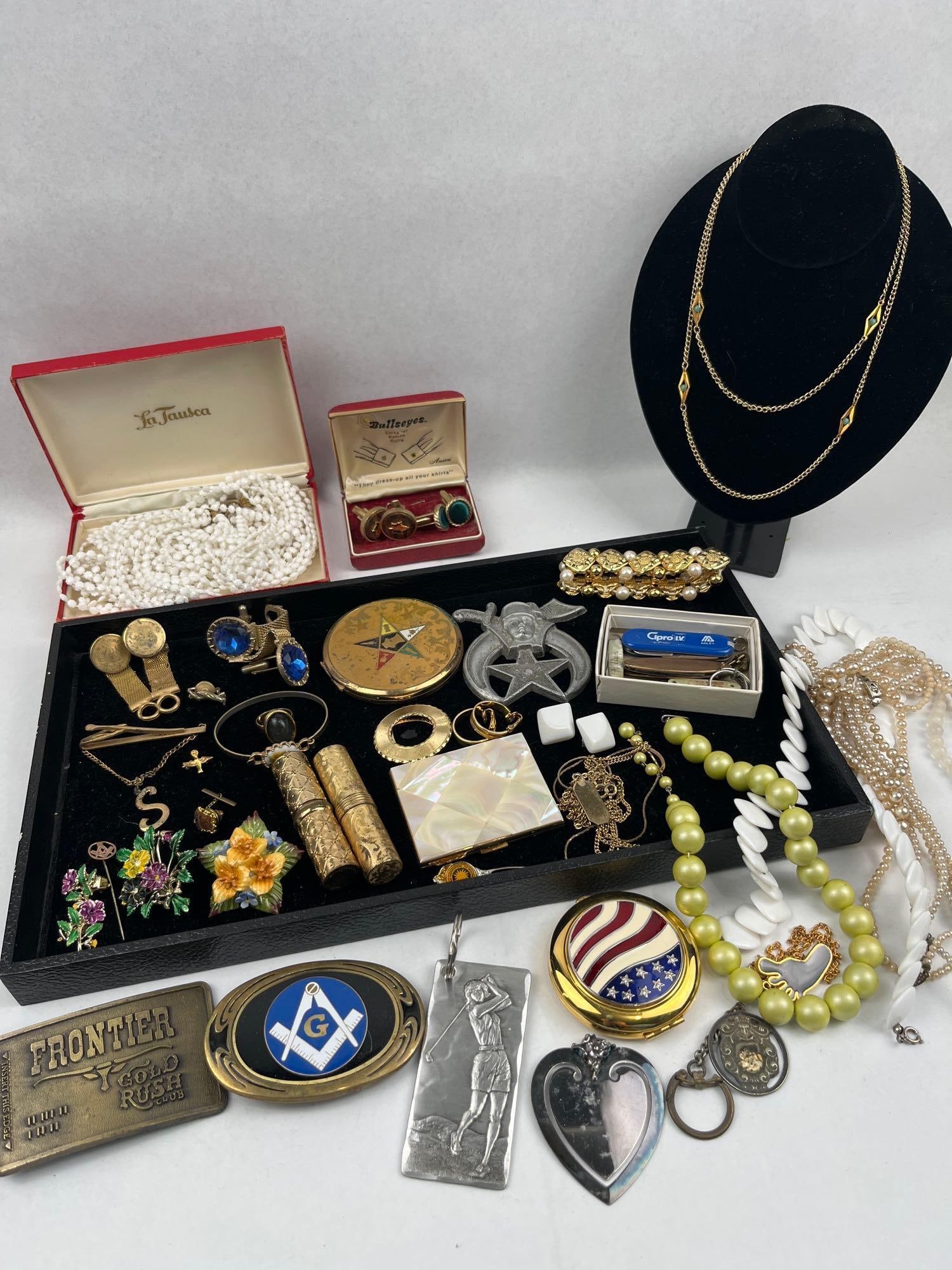 Jewelry, Fraternal & 9 Karat Gold: This group comprises an assortment of vintage jewelry, fraternal items, and personal vanity accessories. A circular Masonic stick pin in yellow metal features the square and compasses; its reverse