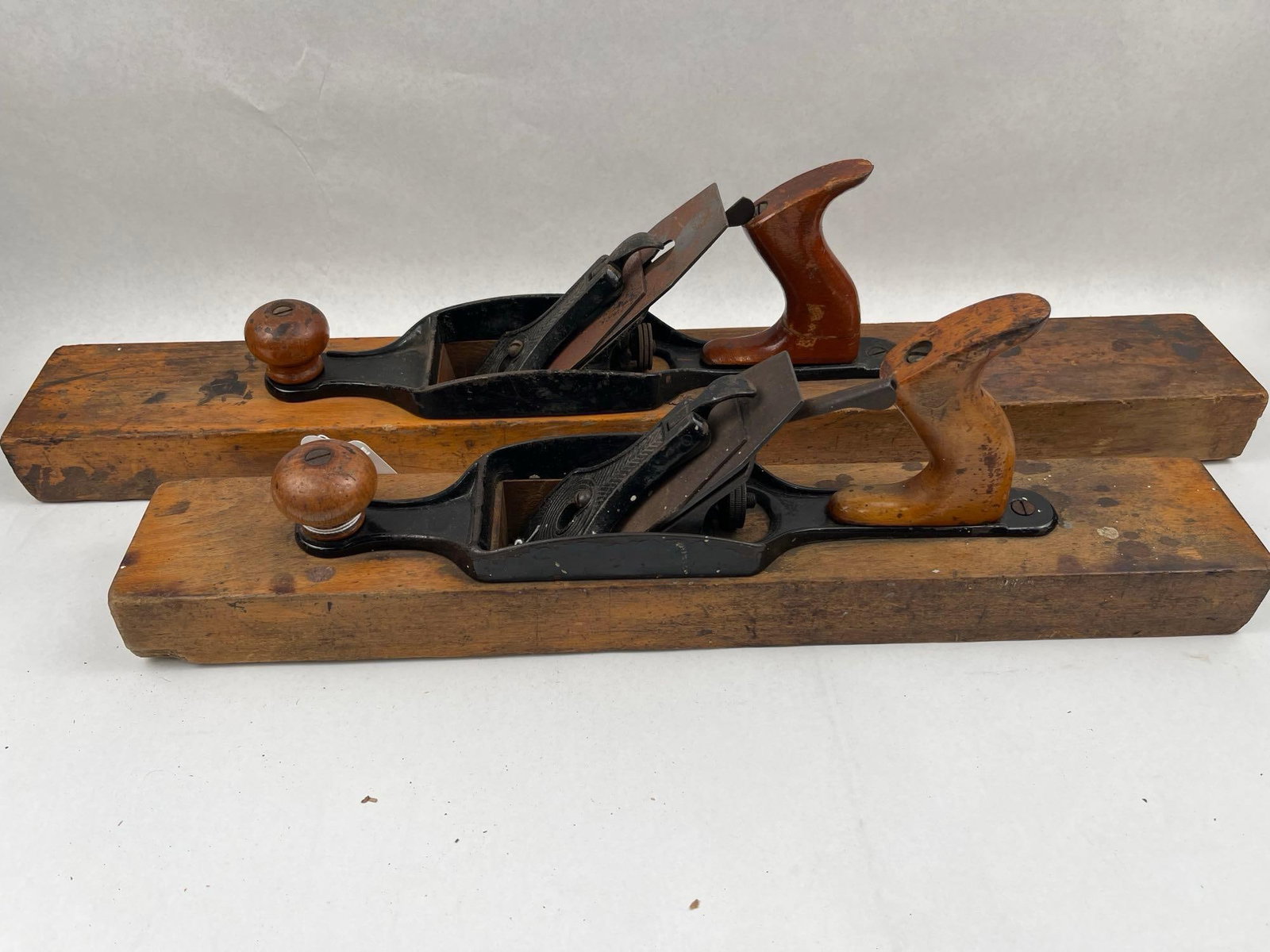 Pair Sargent & Co. Transitional Planes: Two American transitional woodworking hand planes featuring beechwood bodies and cast iron mechanical assemblies. The smaller plane features an impressed mark at the toe of the sole reading SARGENT &